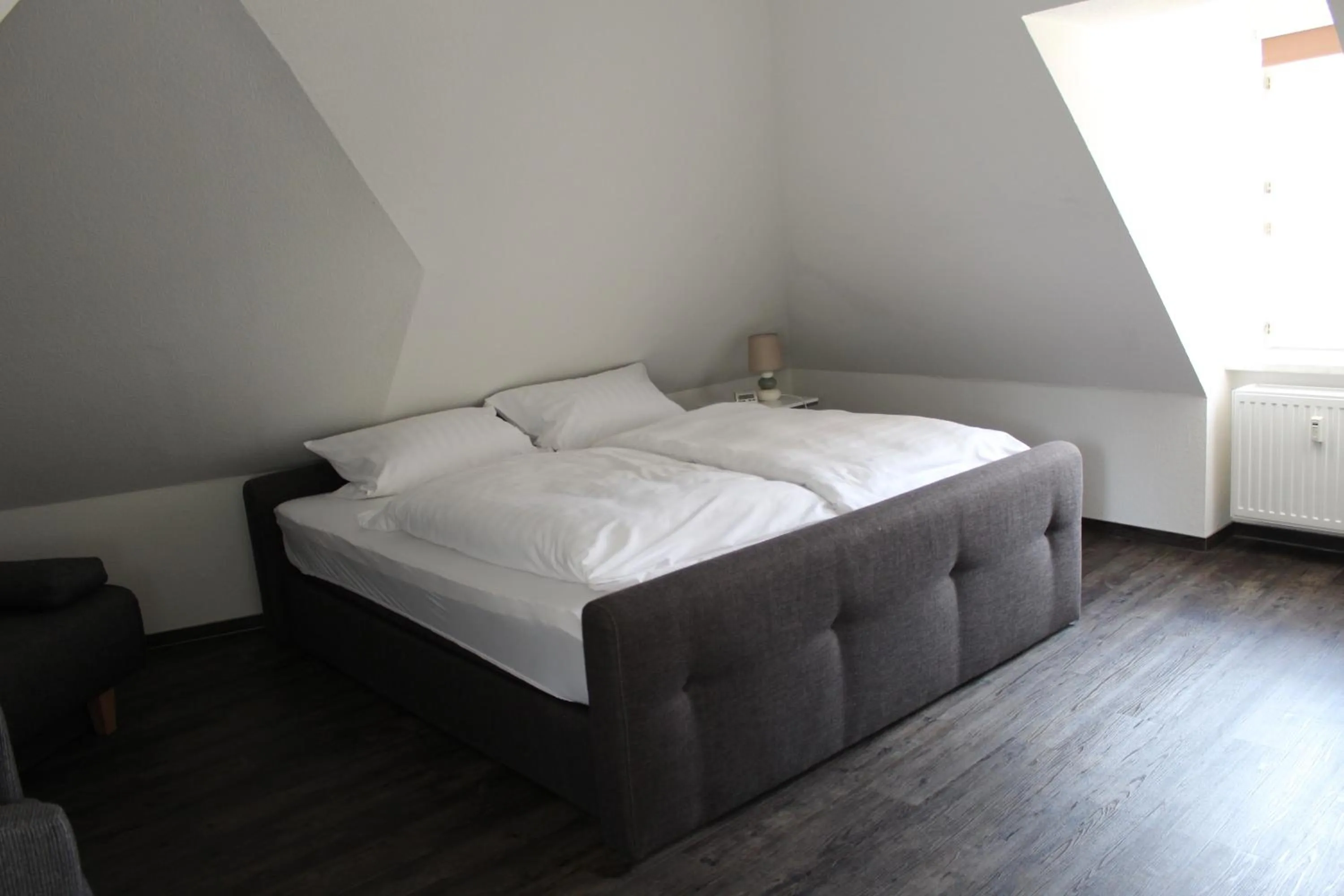 Bed in Apartments am Brunnen