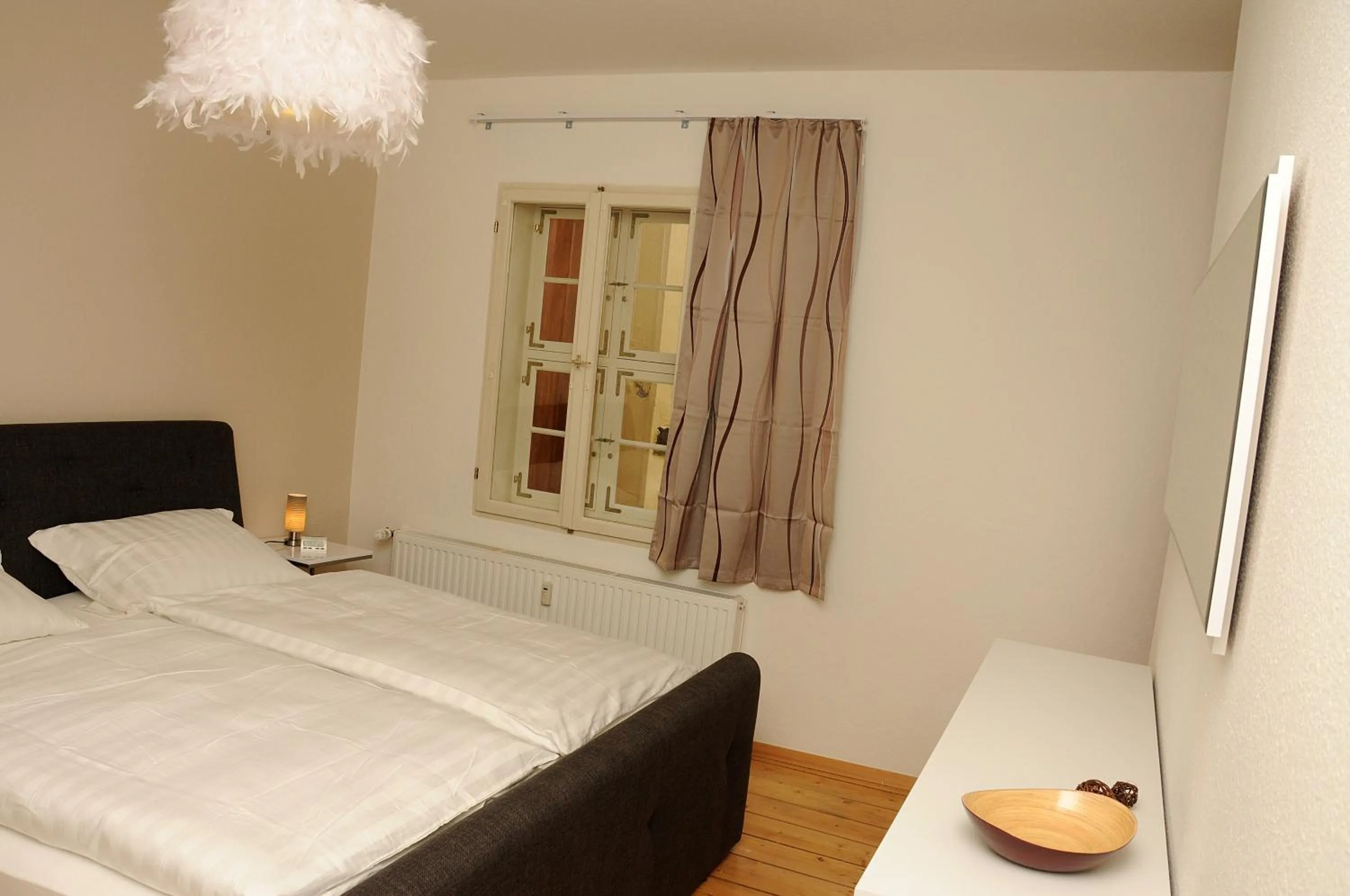 Bed in Apartments am Brunnen