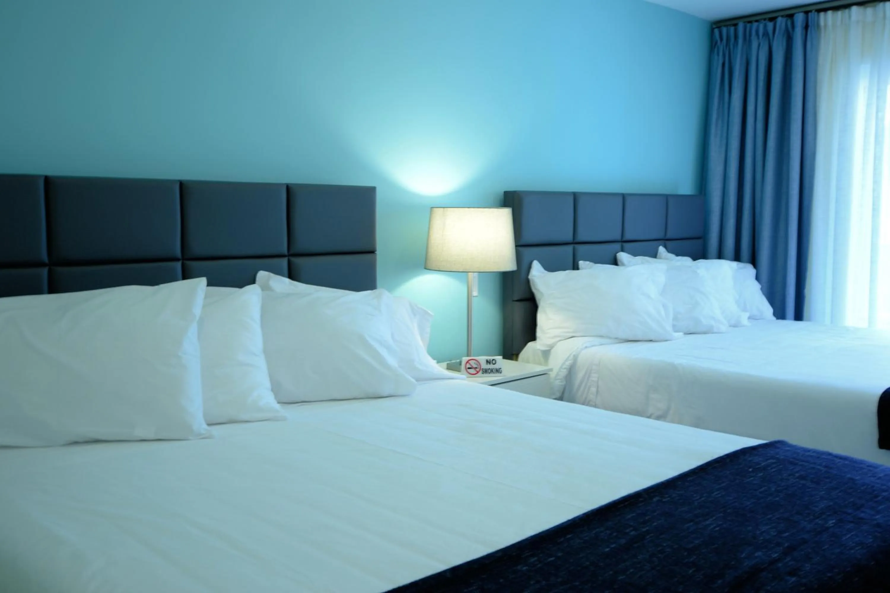 Bed in Quints Travelers Inn