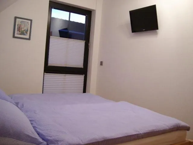Bedroom, Bed in Haus Kollwitzweg - Ferienwohnungen
