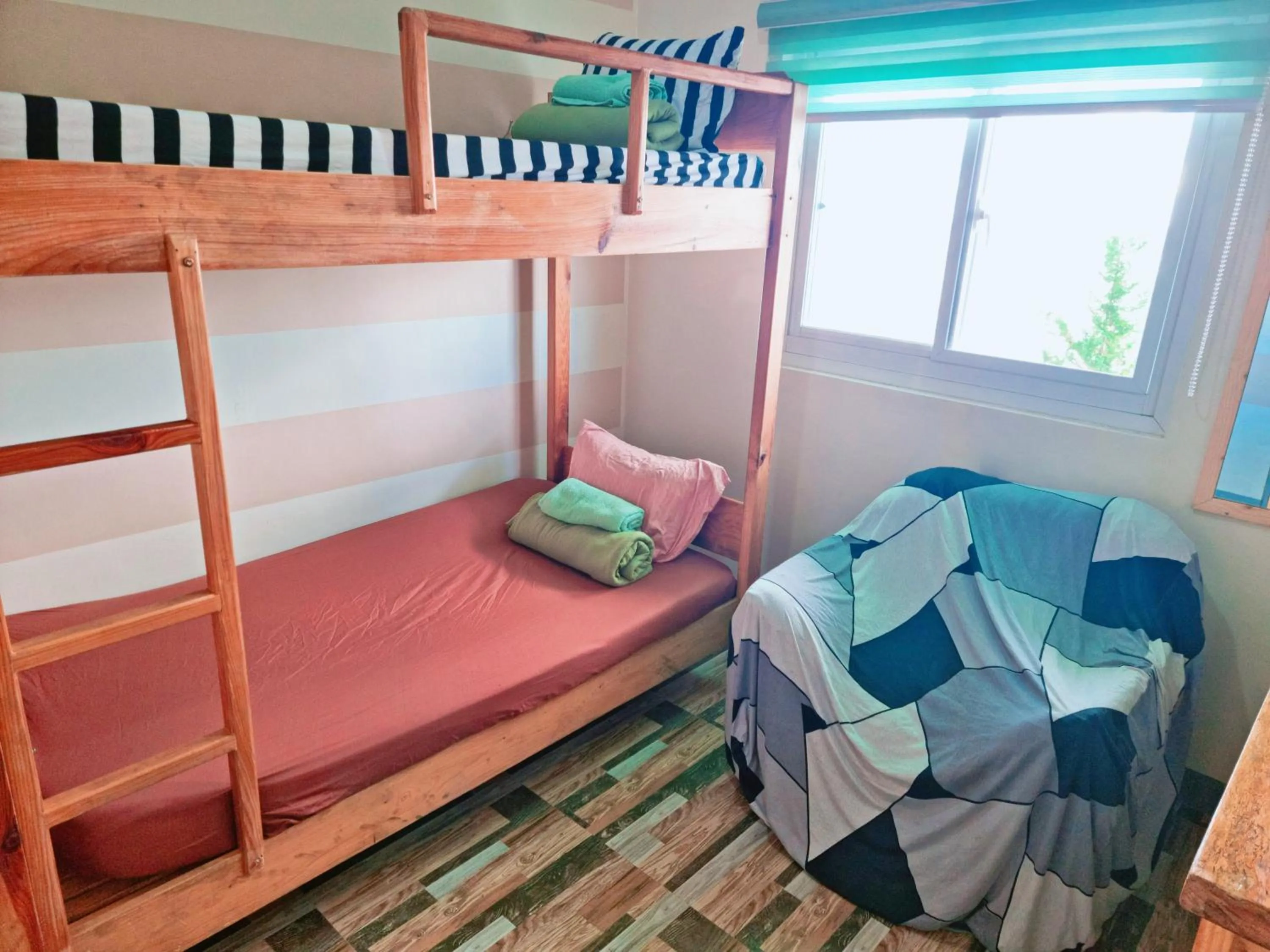 Bed in Wanay's Rocky Mountain Homestay