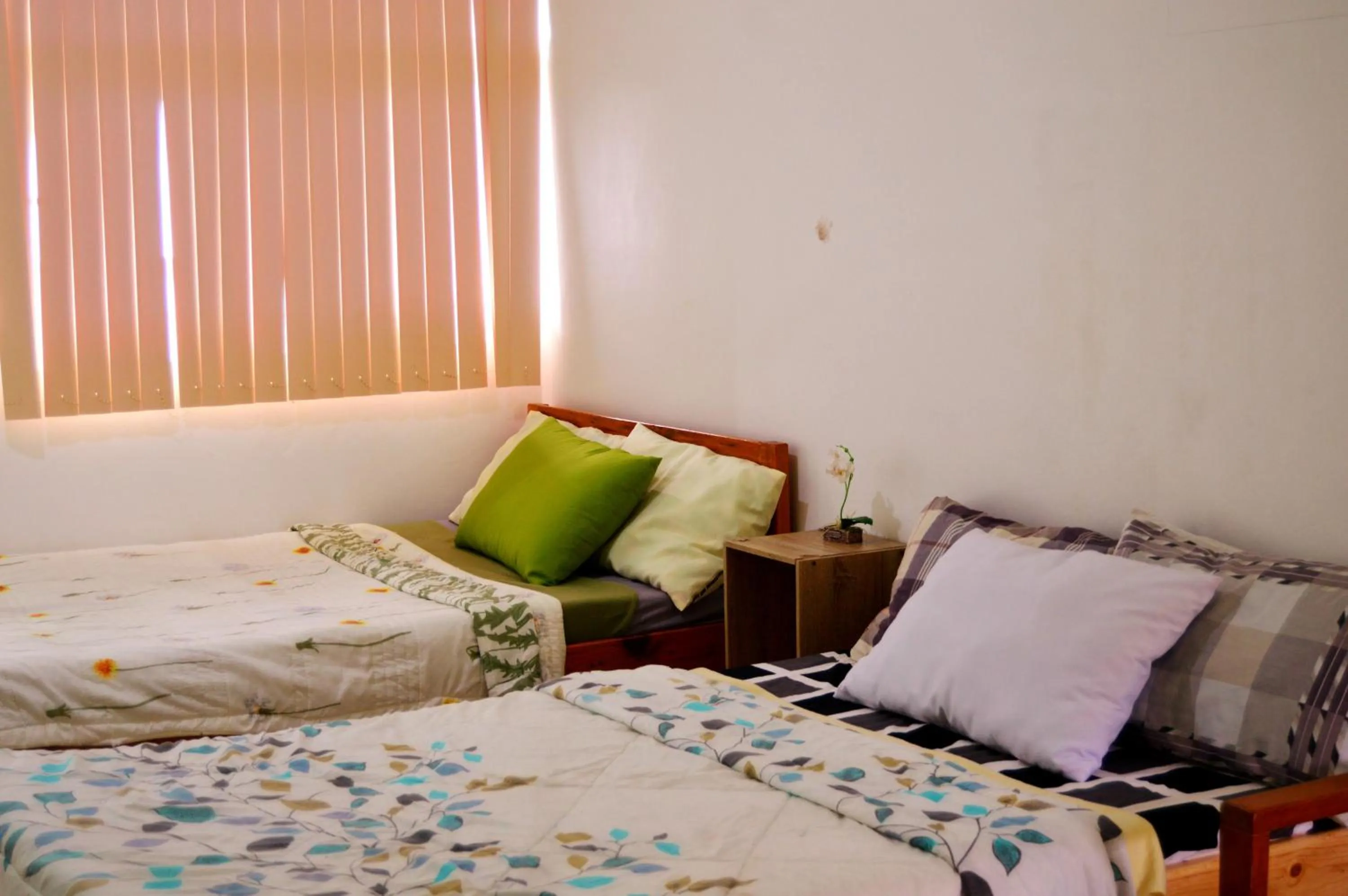 Bed in Wanay's Rocky Mountain Homestay