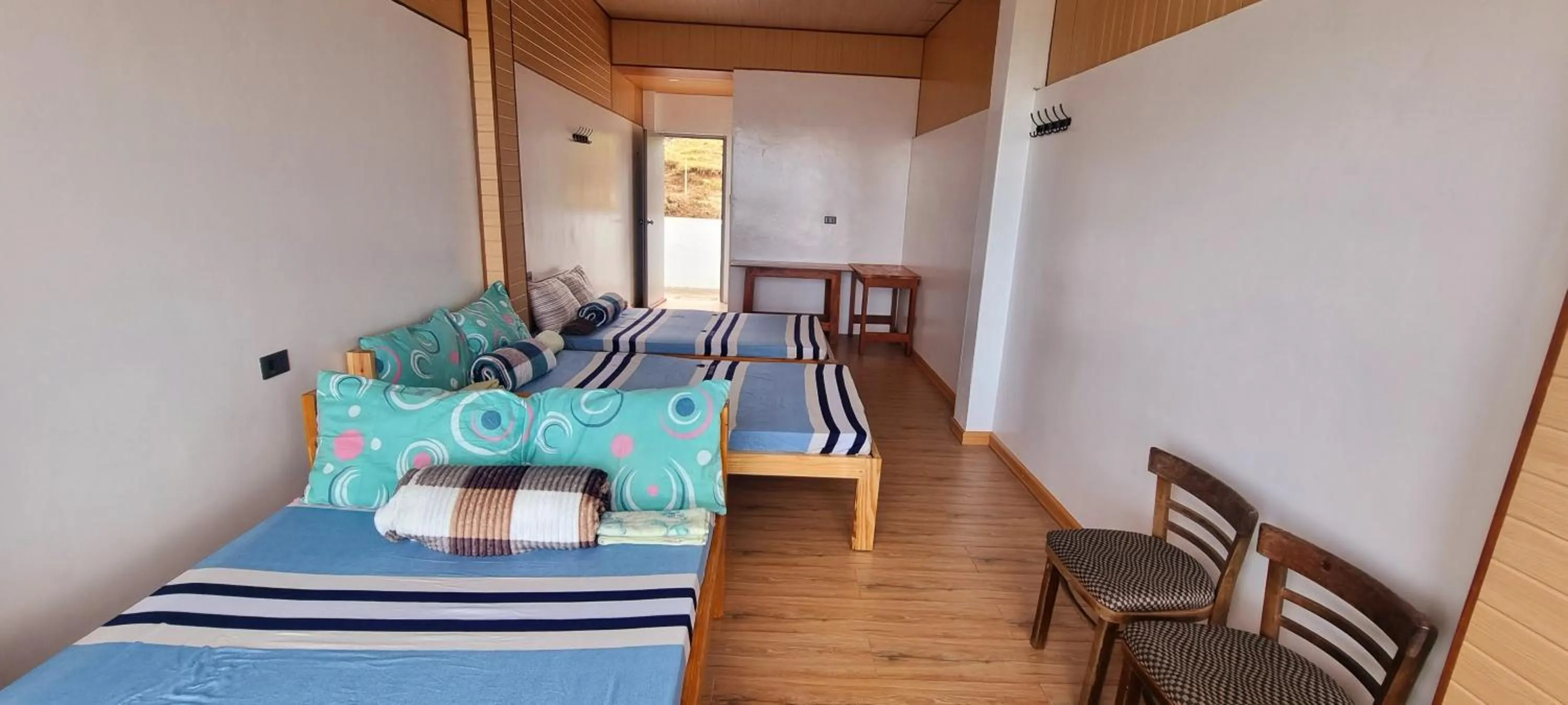 Bed in Wanay's Rocky Mountain Homestay