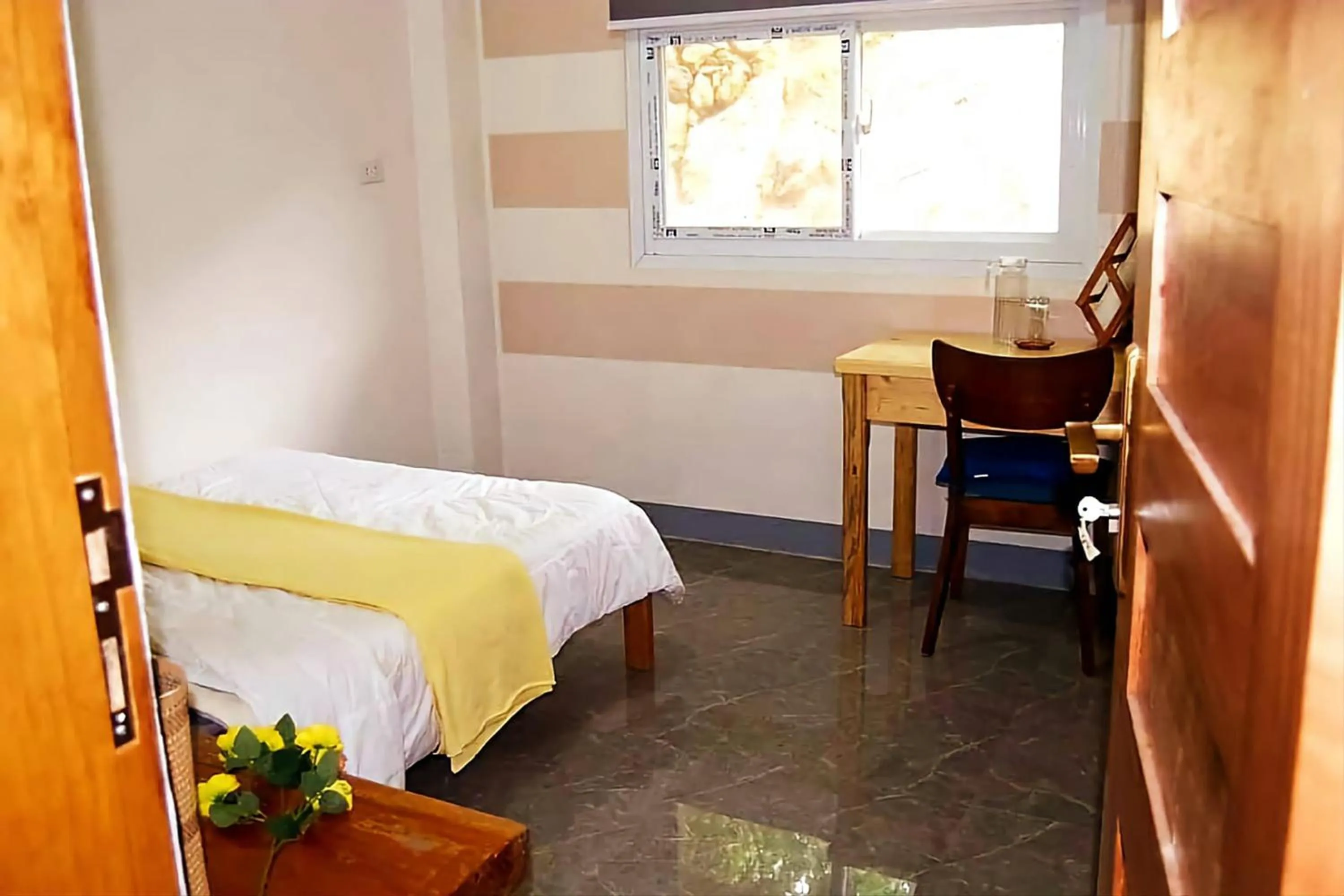 Bed in Wanay's Rocky Mountain Homestay