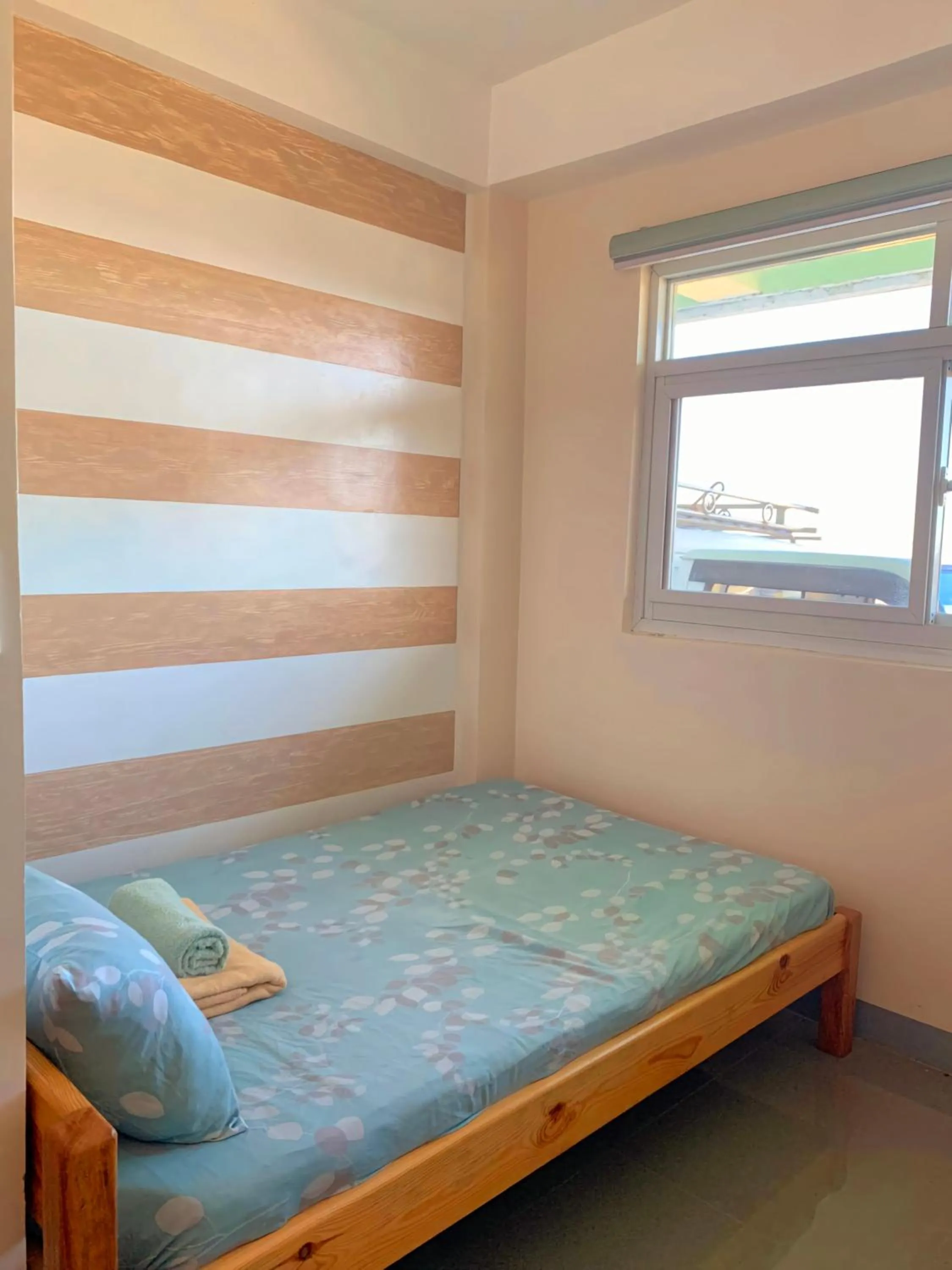 Bed in Wanay's Rocky Mountain Homestay