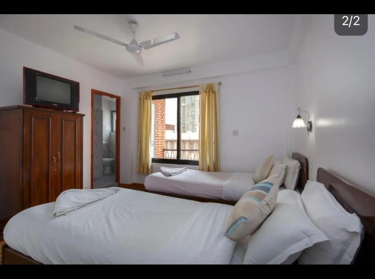 Bed in Pacific Guest House