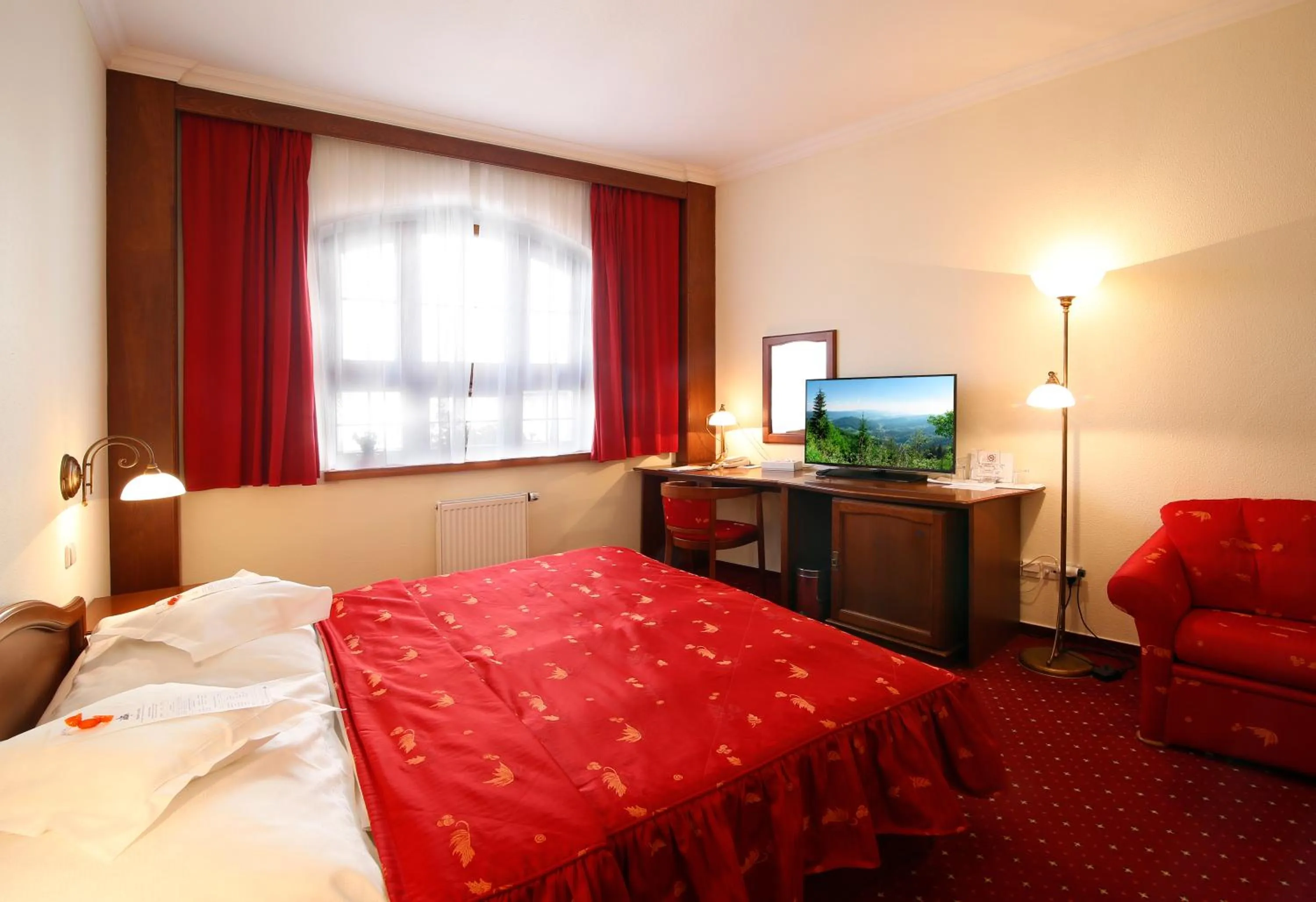 Seating area, Bed in AGH Hotel