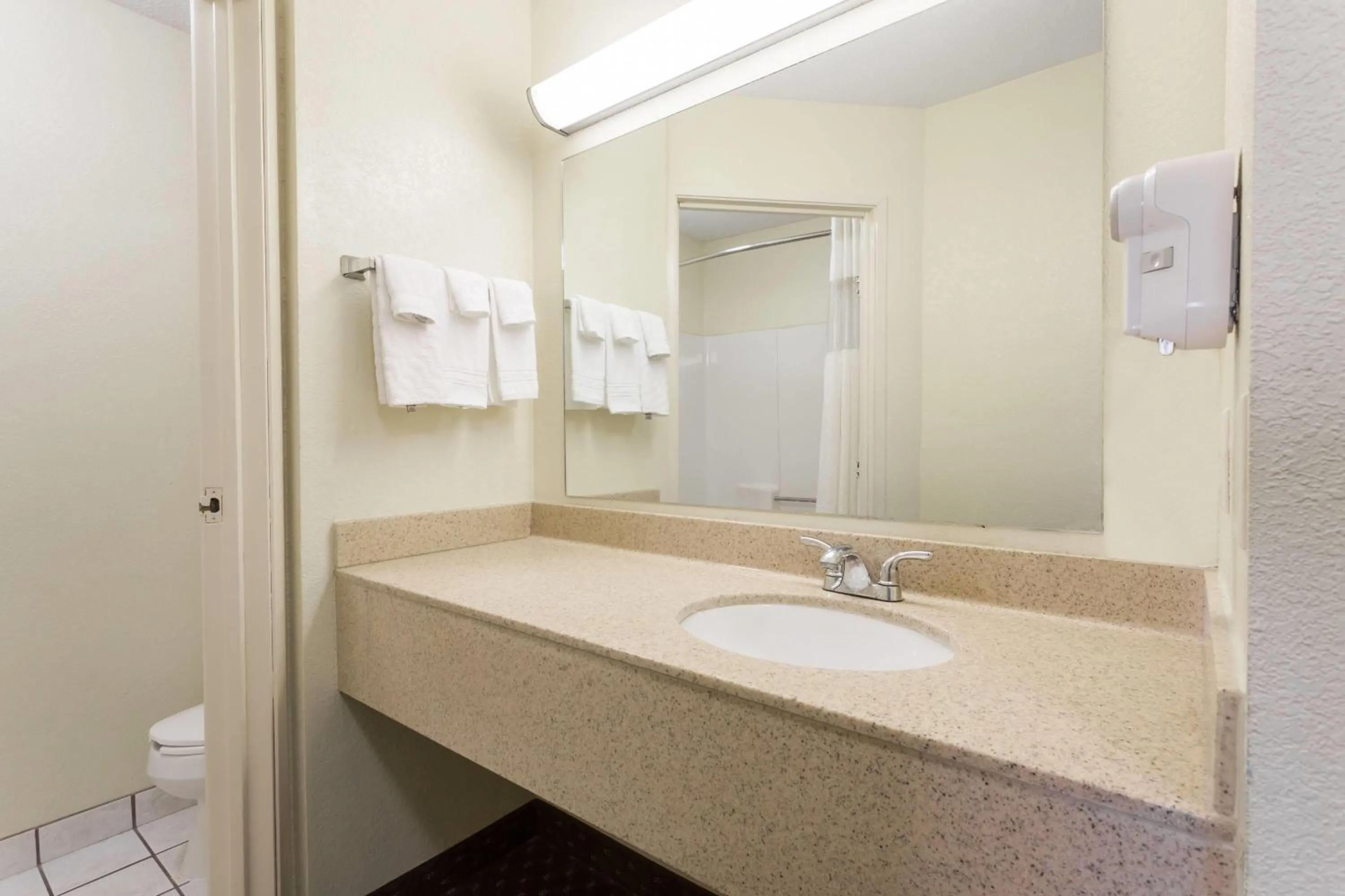 Bathroom in Days Inn & Suites by Wyndham Bloomington/Normal IL