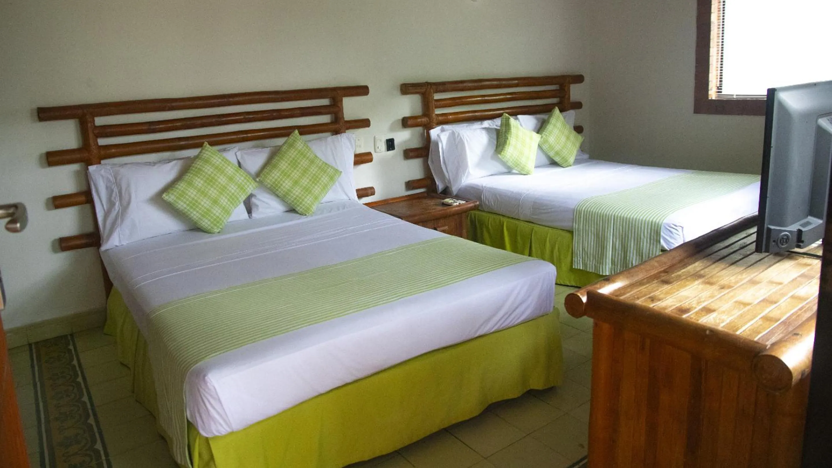 Bed in Hotel Girardot Resort by On Vacation