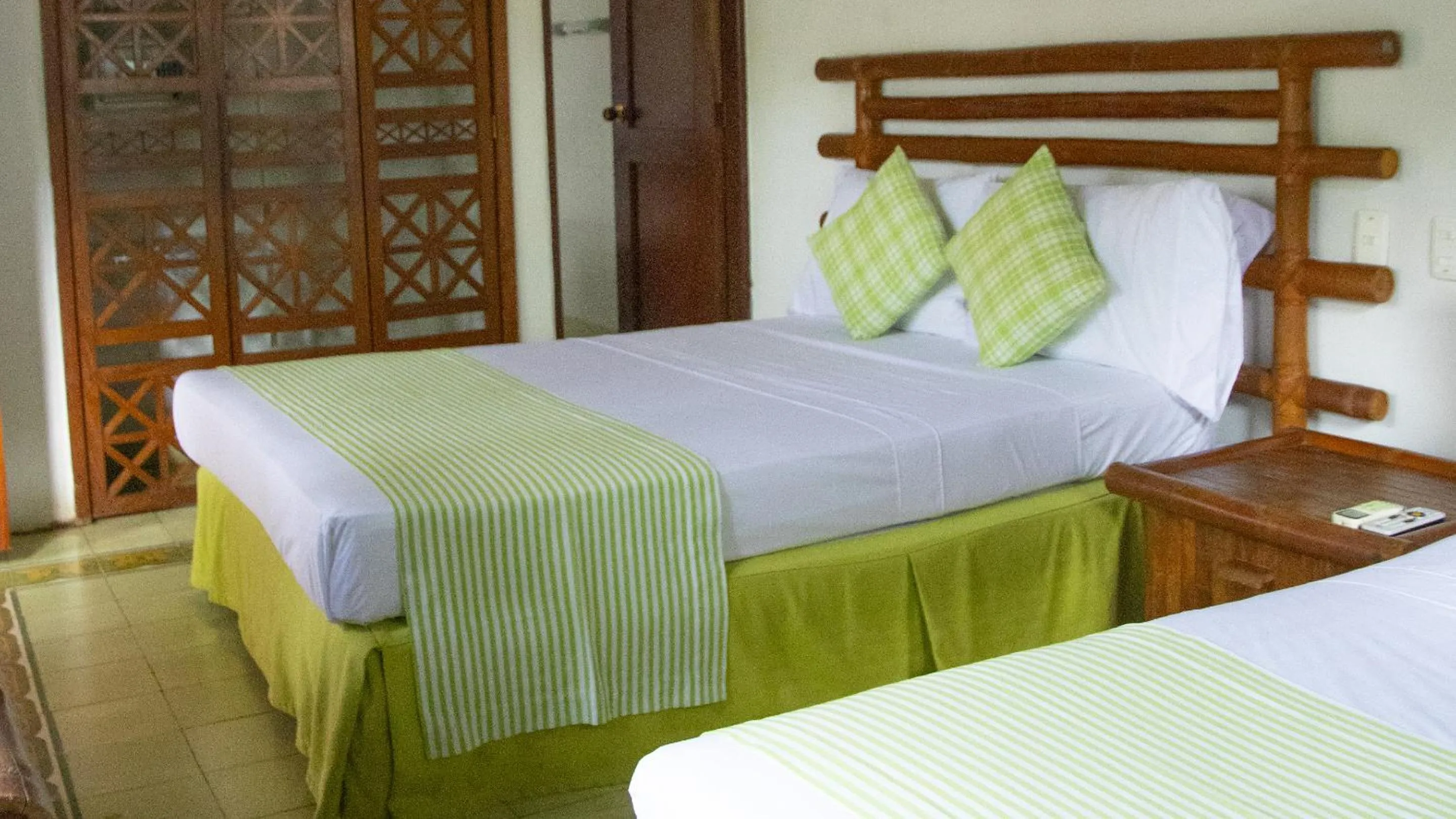 Bed in Hotel Girardot Resort by On Vacation