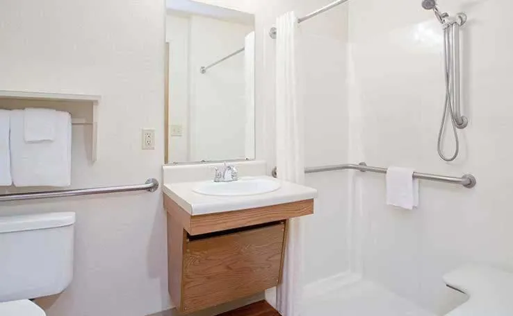 Bathroom in WoodSpring Suites Holland - Grand Rapids