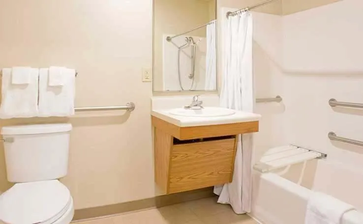 Bathroom in WoodSpring Suites Holland - Grand Rapids