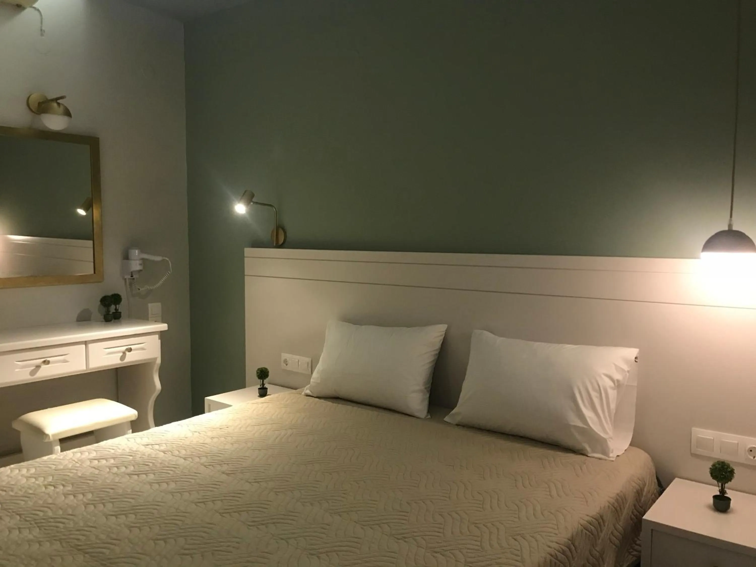 Bed in George Deluxe Apartments