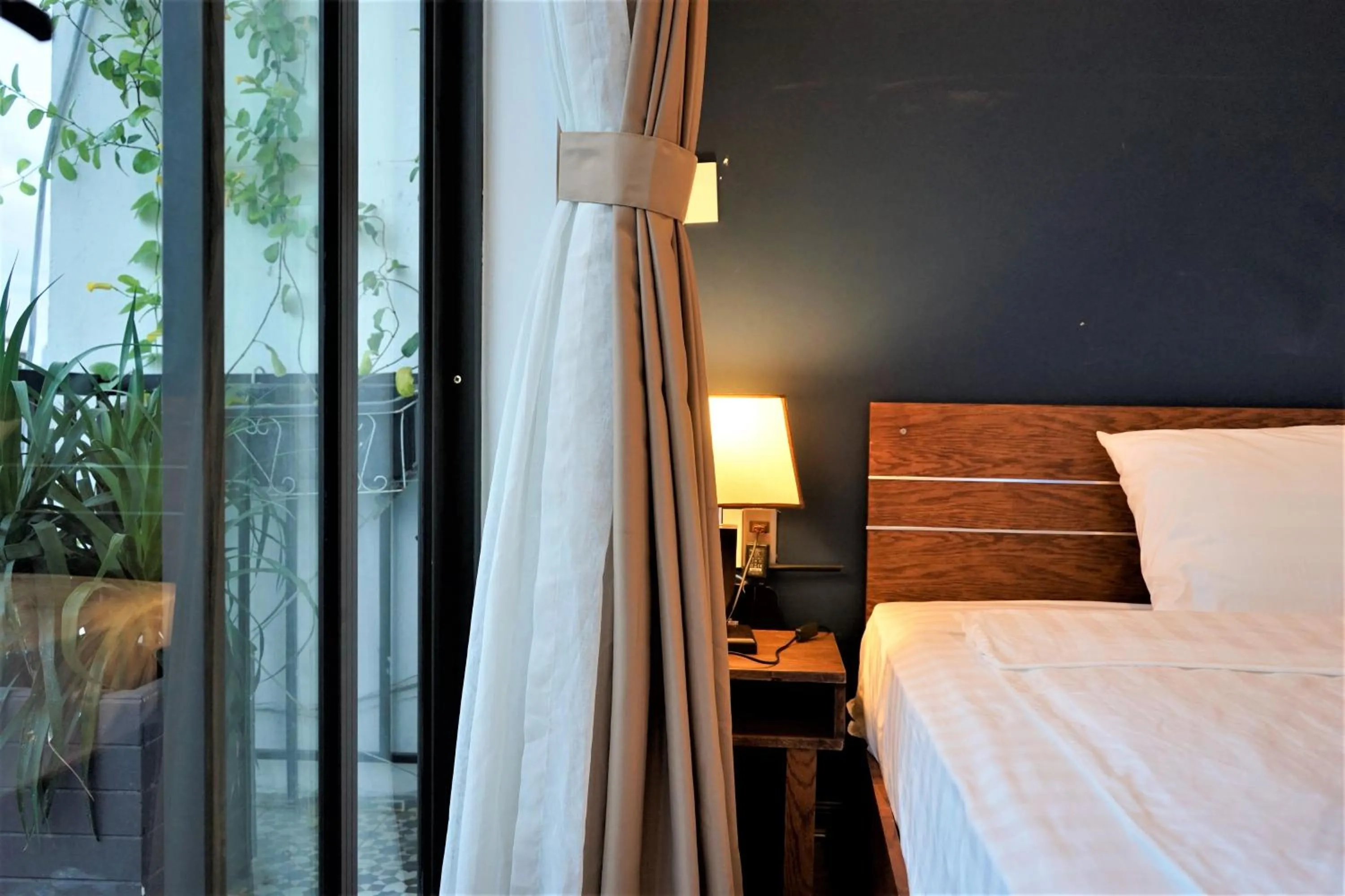 Bed in Oasis Hotel & Apartment