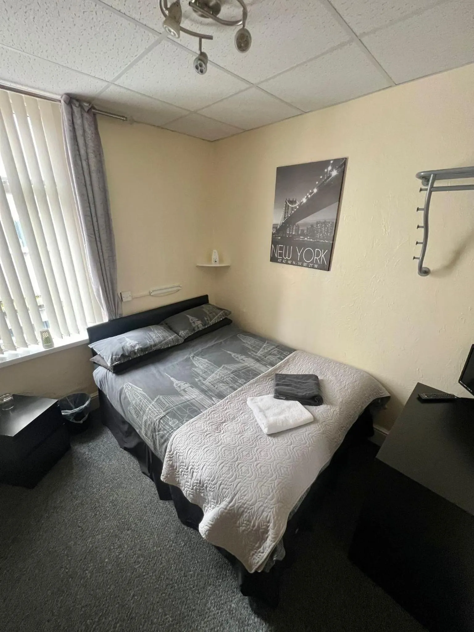 Bed in Tudor Rose Hotel