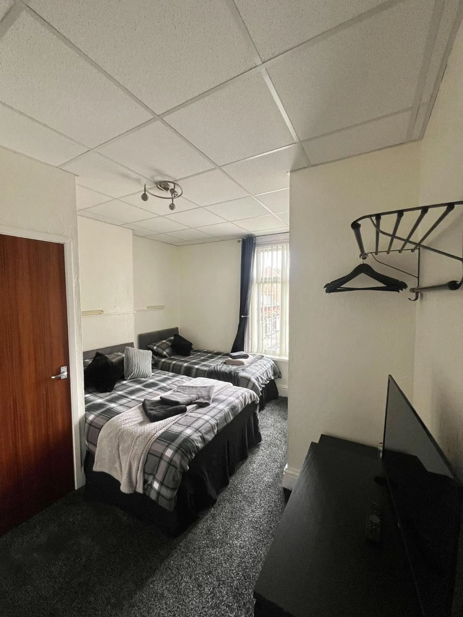 Bed in Tudor Rose Hotel