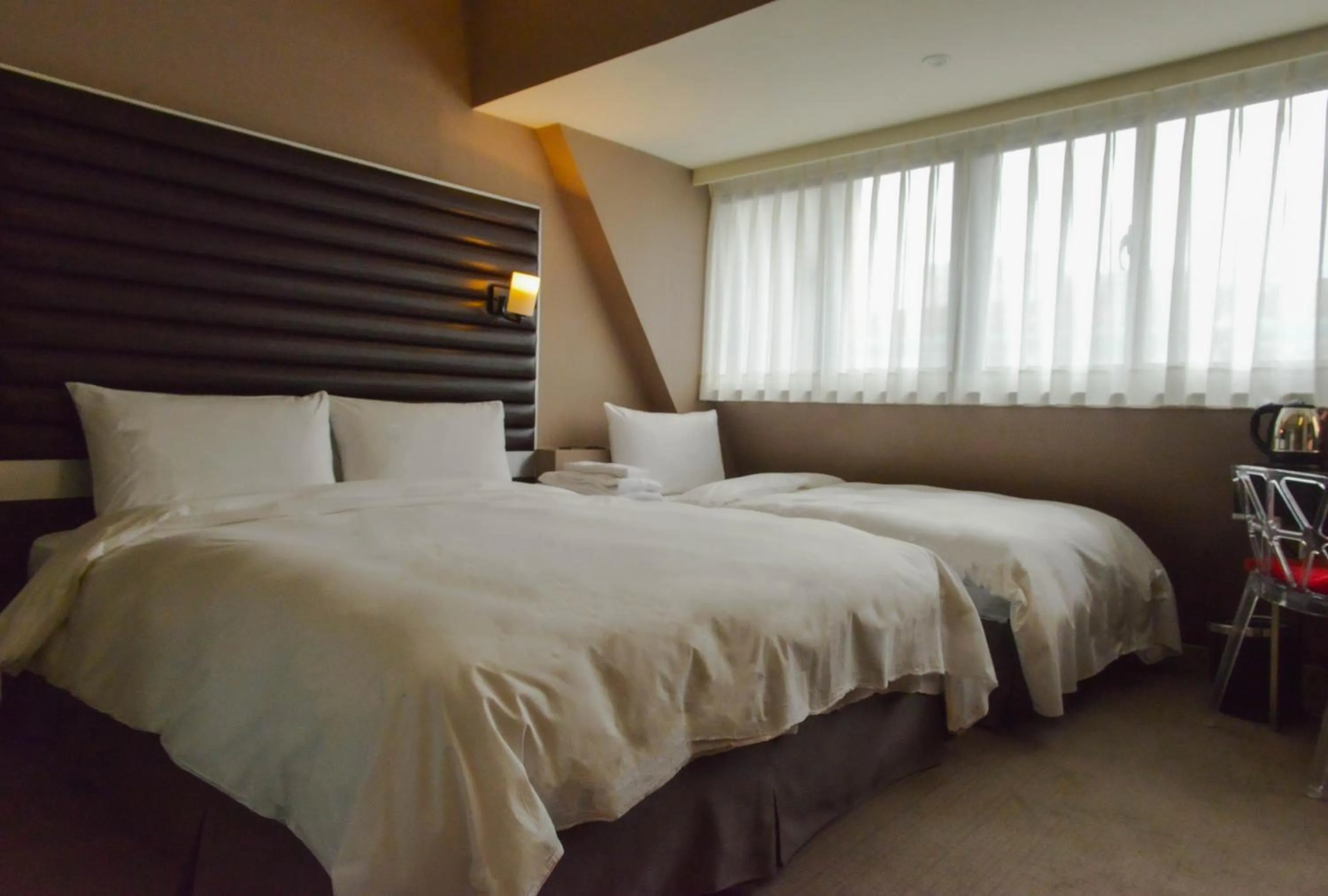 Bed in 新麗旅店 Newful Hotel
