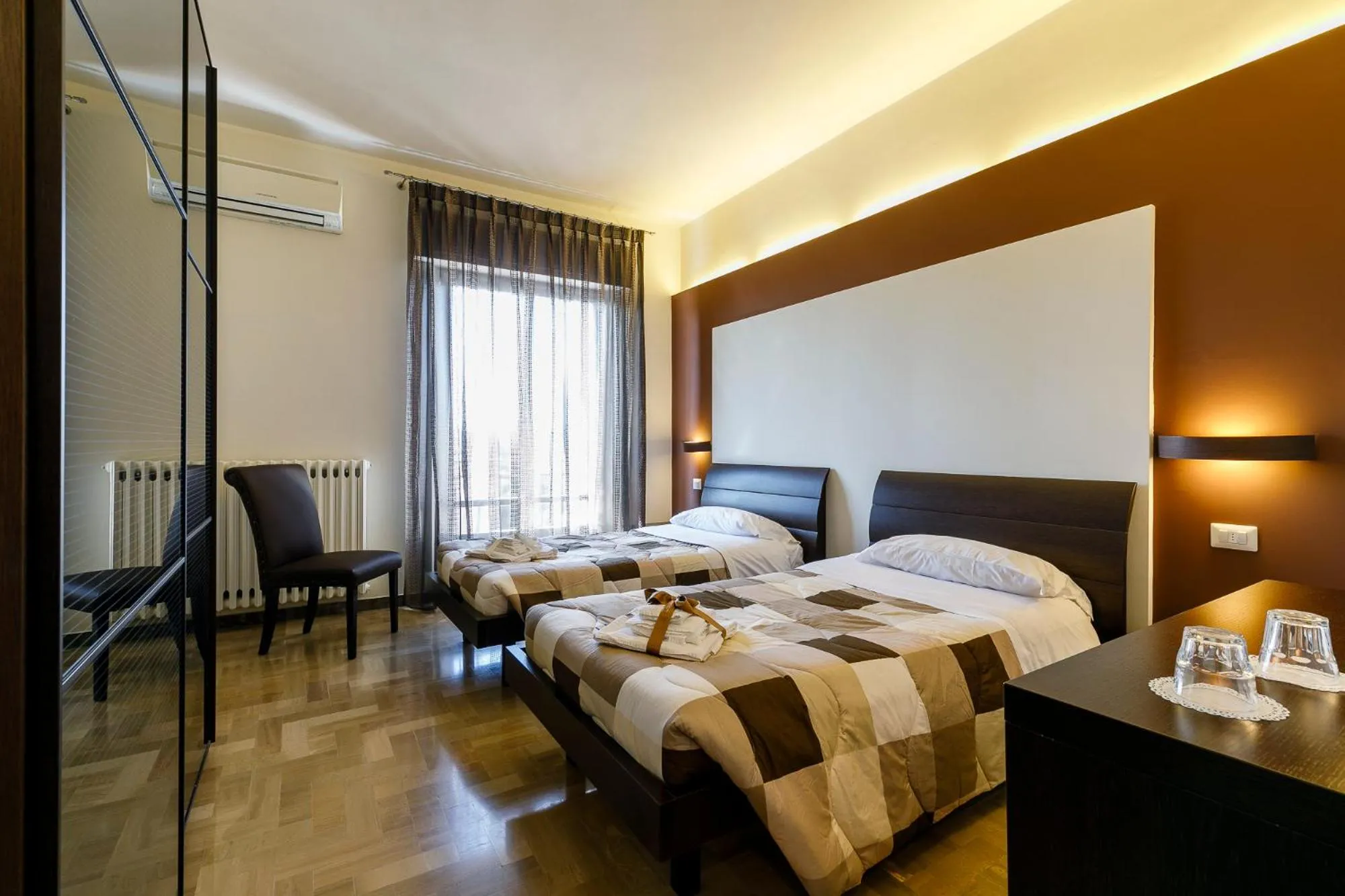 Bed in La Locomotiva Rooms