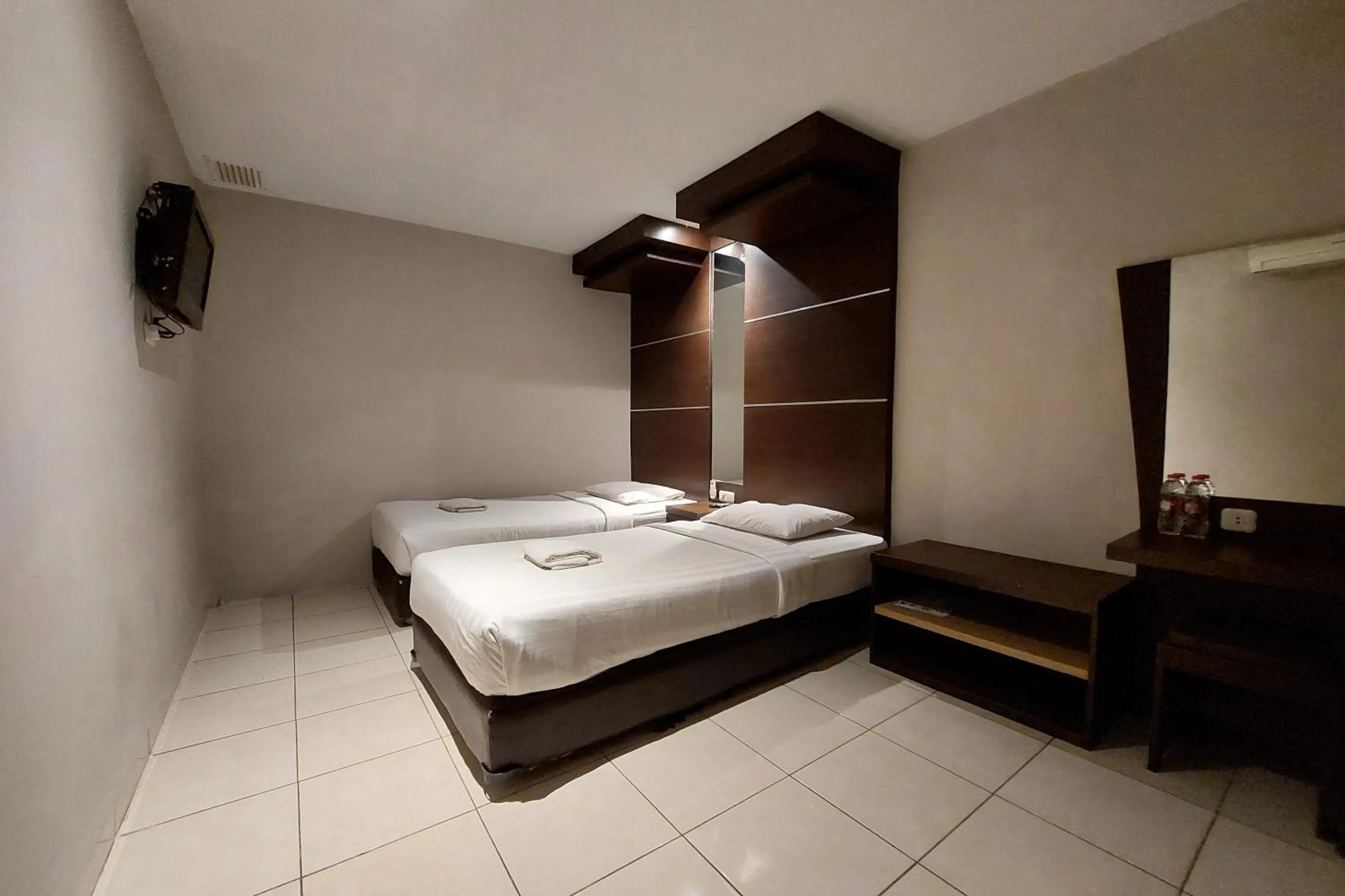 Bed in Hotel Bumi Malaya