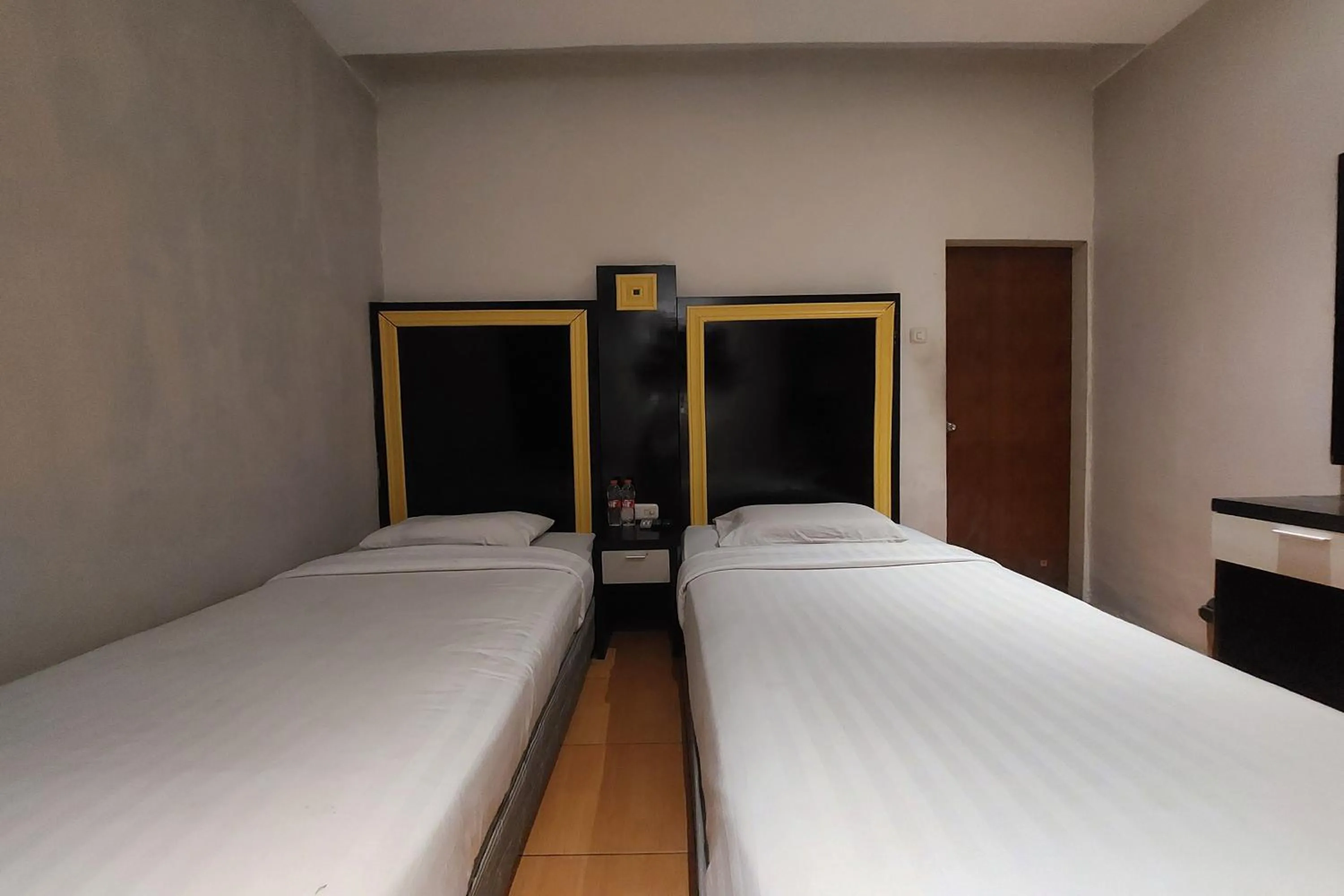 Bed in Hotel Bumi Malaya