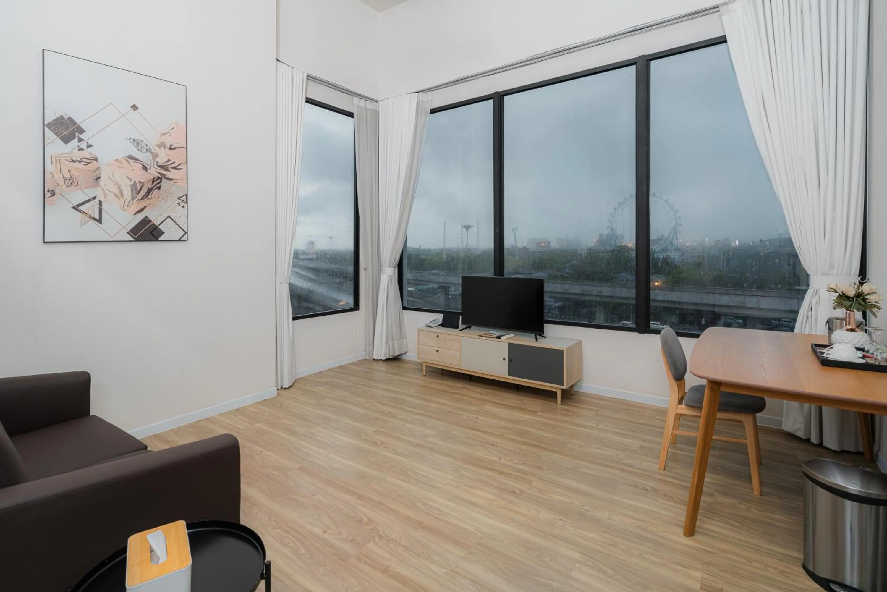 Living room in SureStay by Best Western Bangkok Ramintra