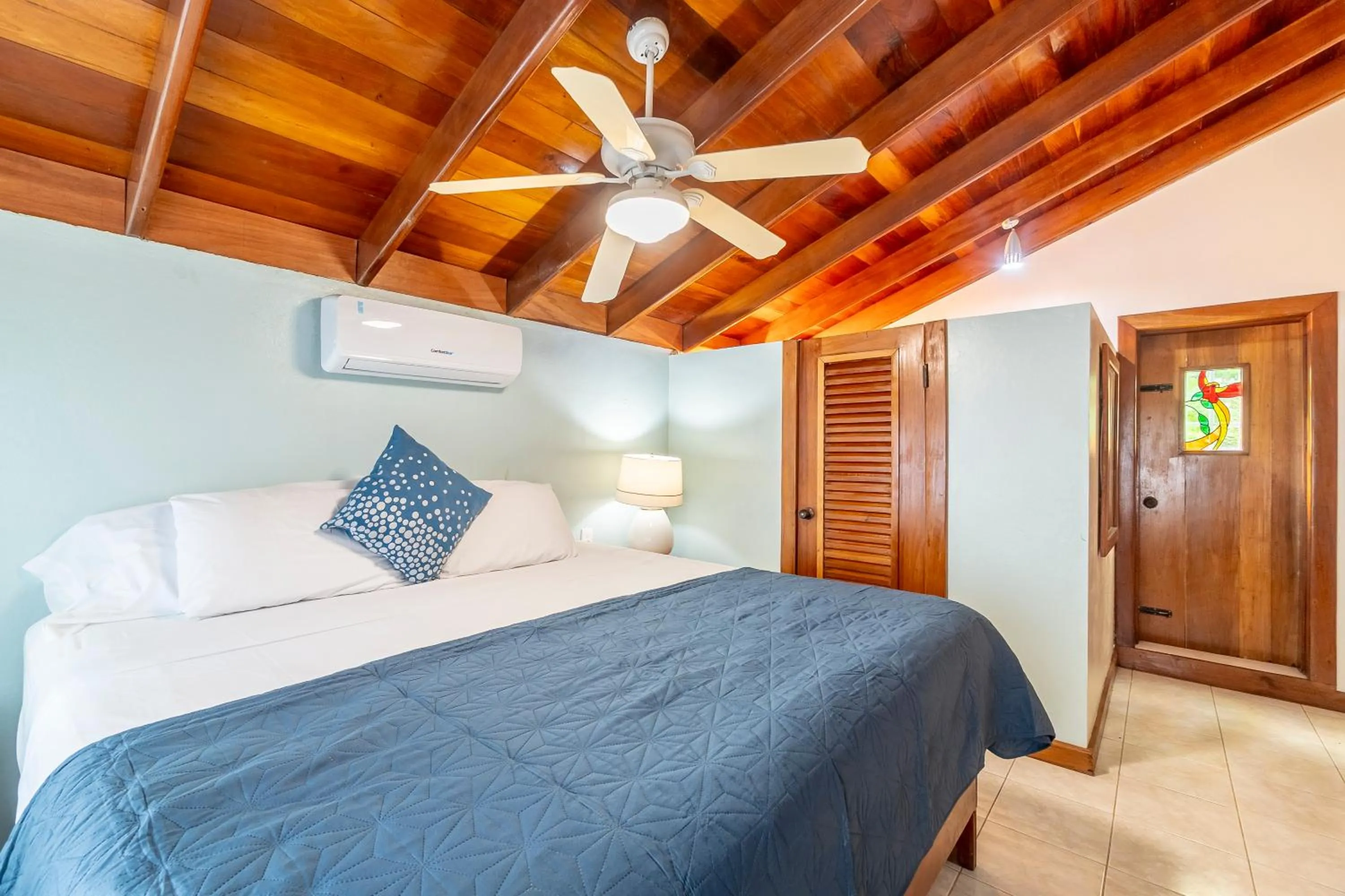 Bed in Caribbean Villas Hotel