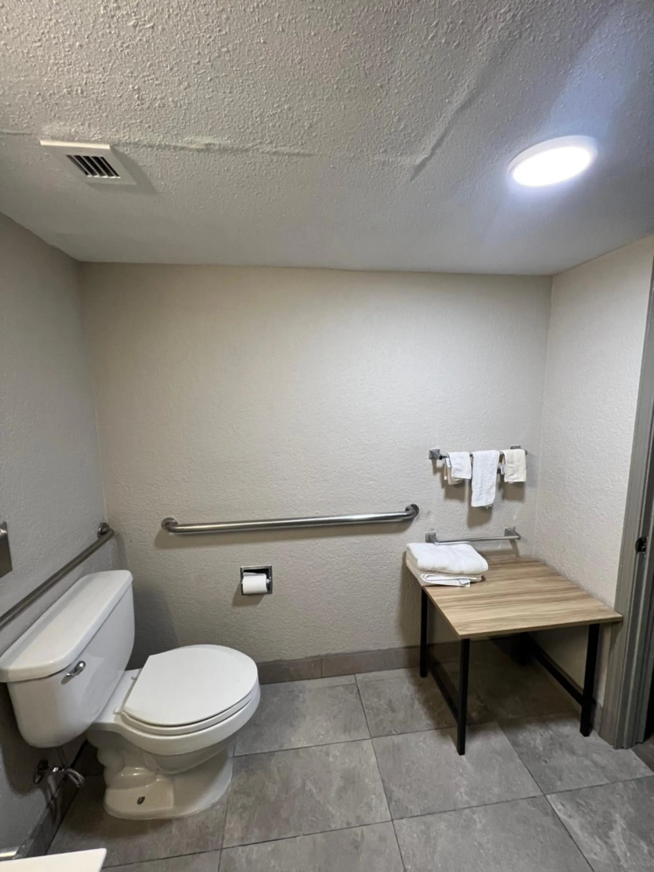 Toilet in Days Inn by Wyndham Sulphur West
