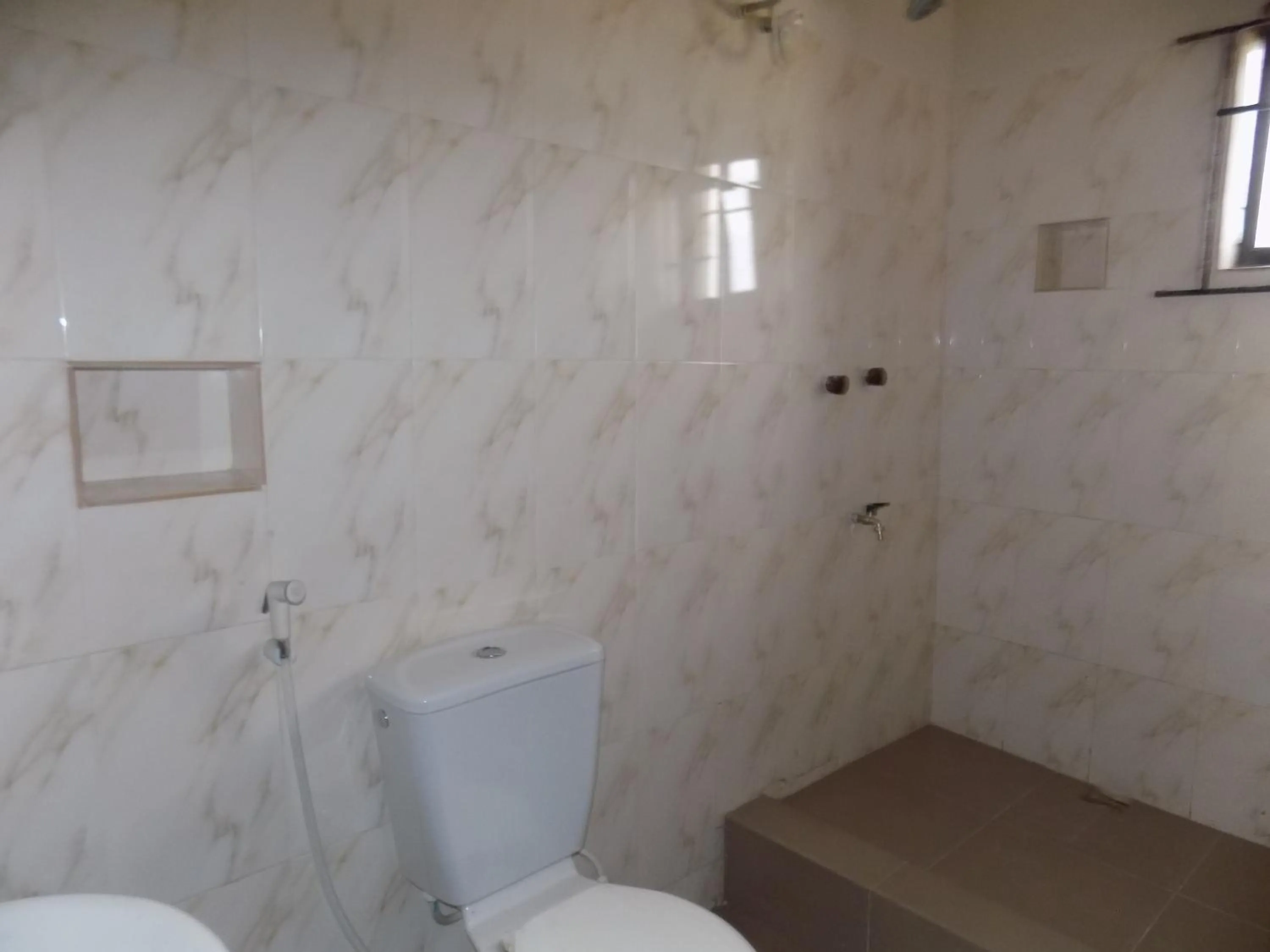 Bathroom in Posh Apartments Business Hotel