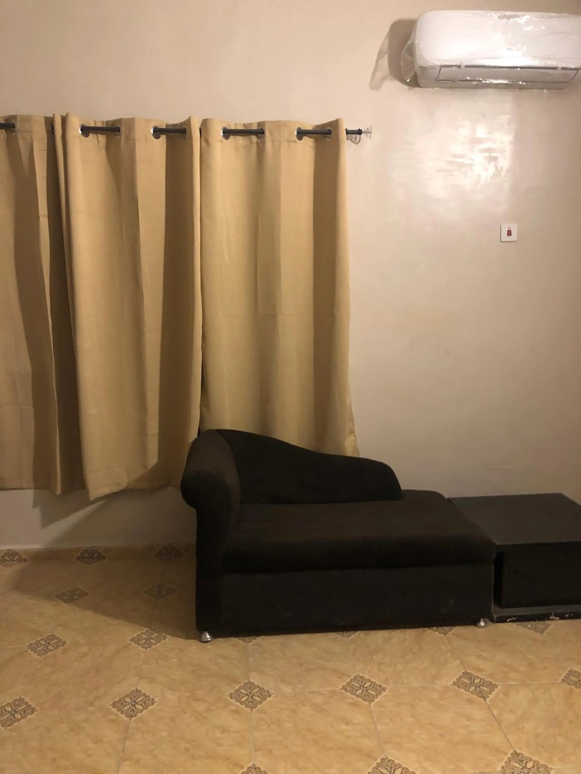 Seating area in Posh Apartments Business Hotel