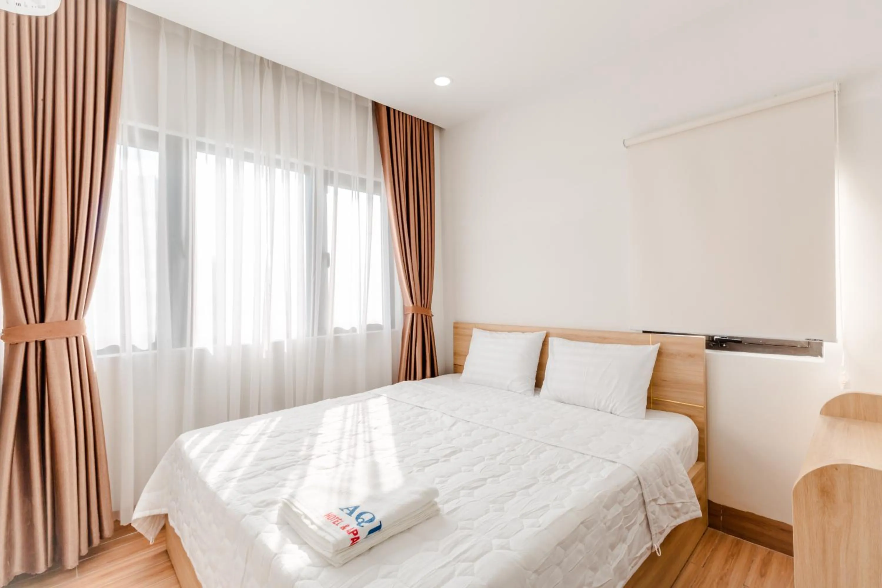 Bed in AQUA Seaview Hotel