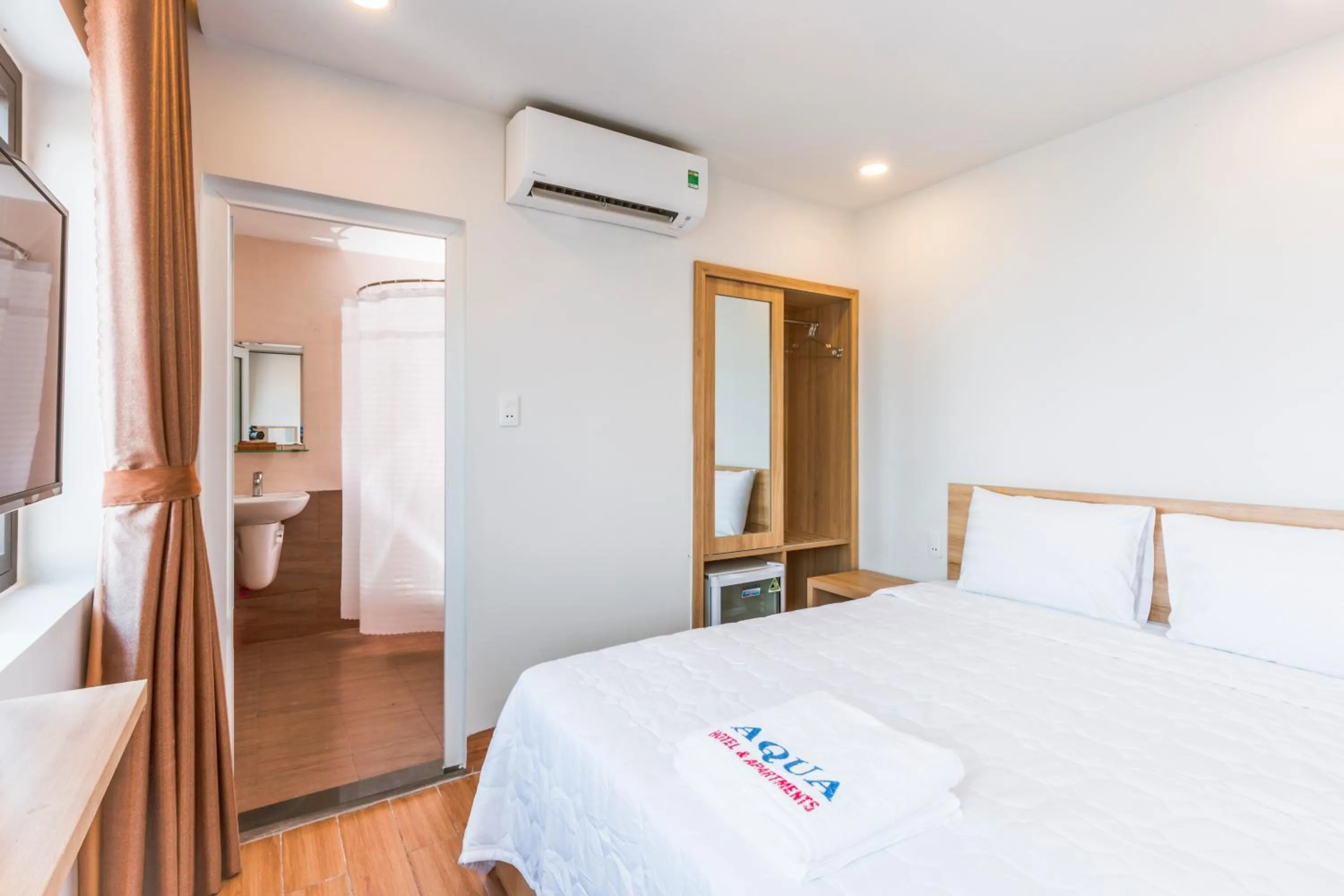 Bed in AQUA Seaview Hotel