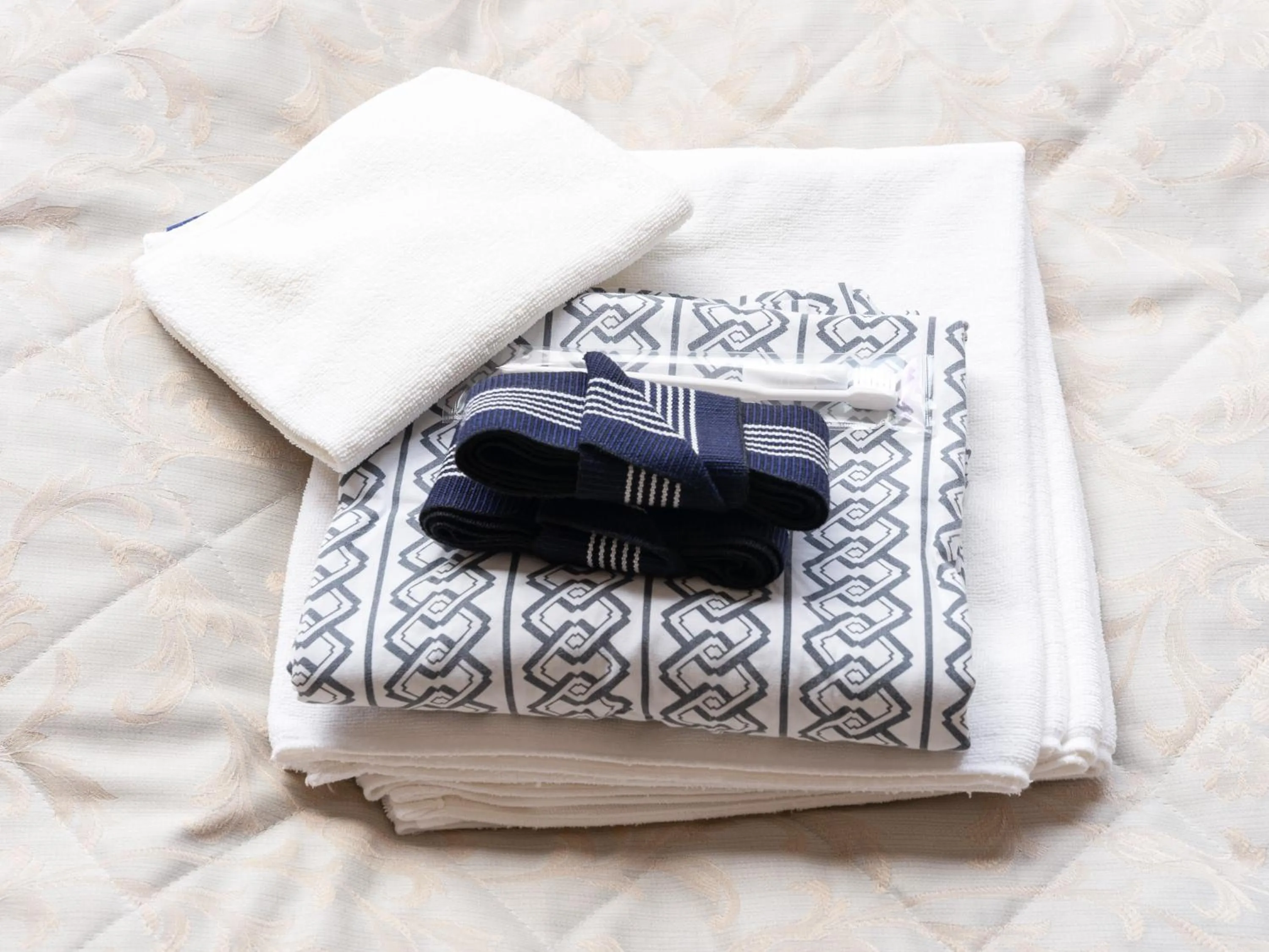 Bed in Tabist Kanko Business Hotel Matsuyama Hida Takayama