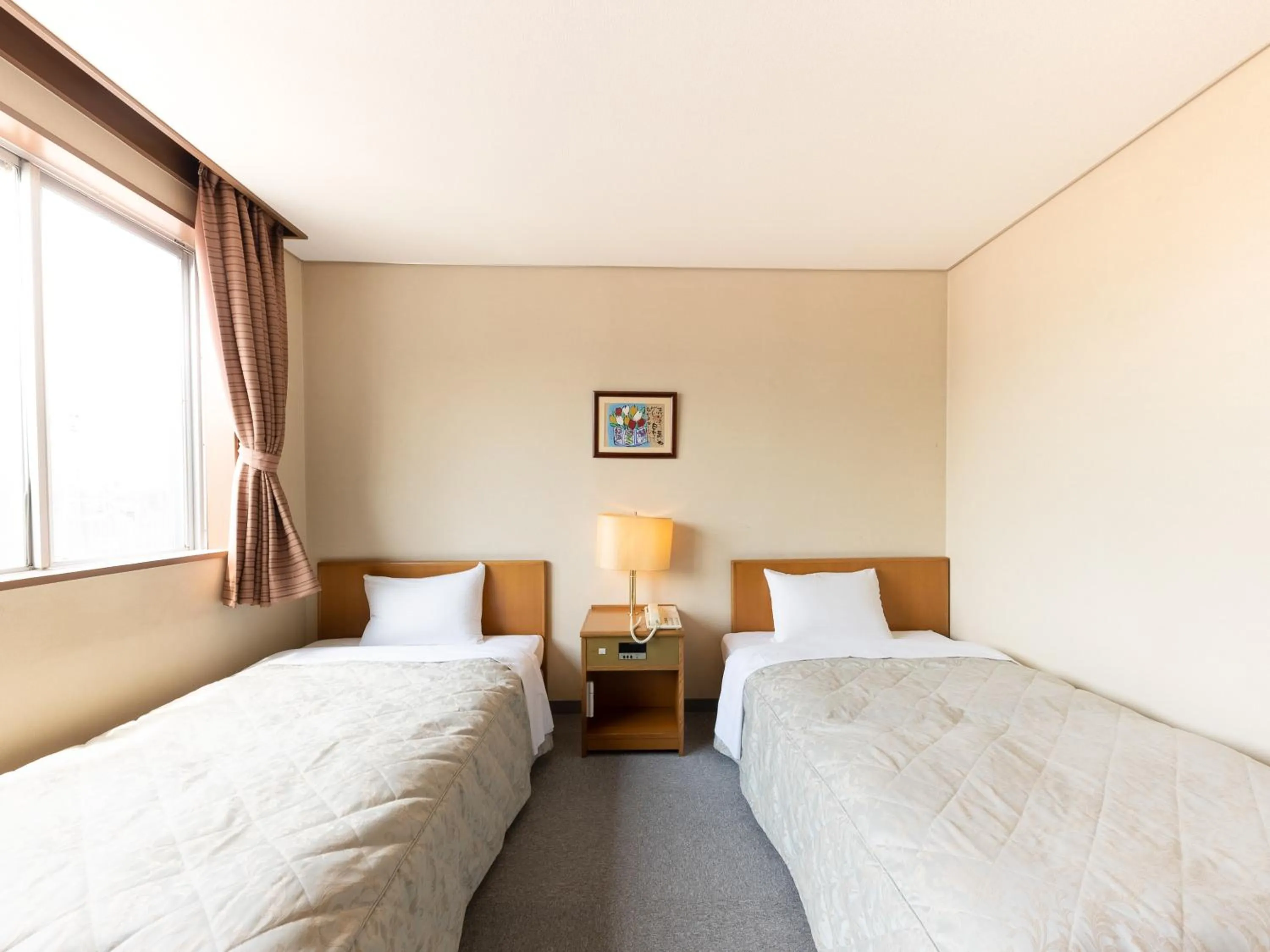 Bed in Tabist Kanko Business Hotel Matsuyama Hida Takayama