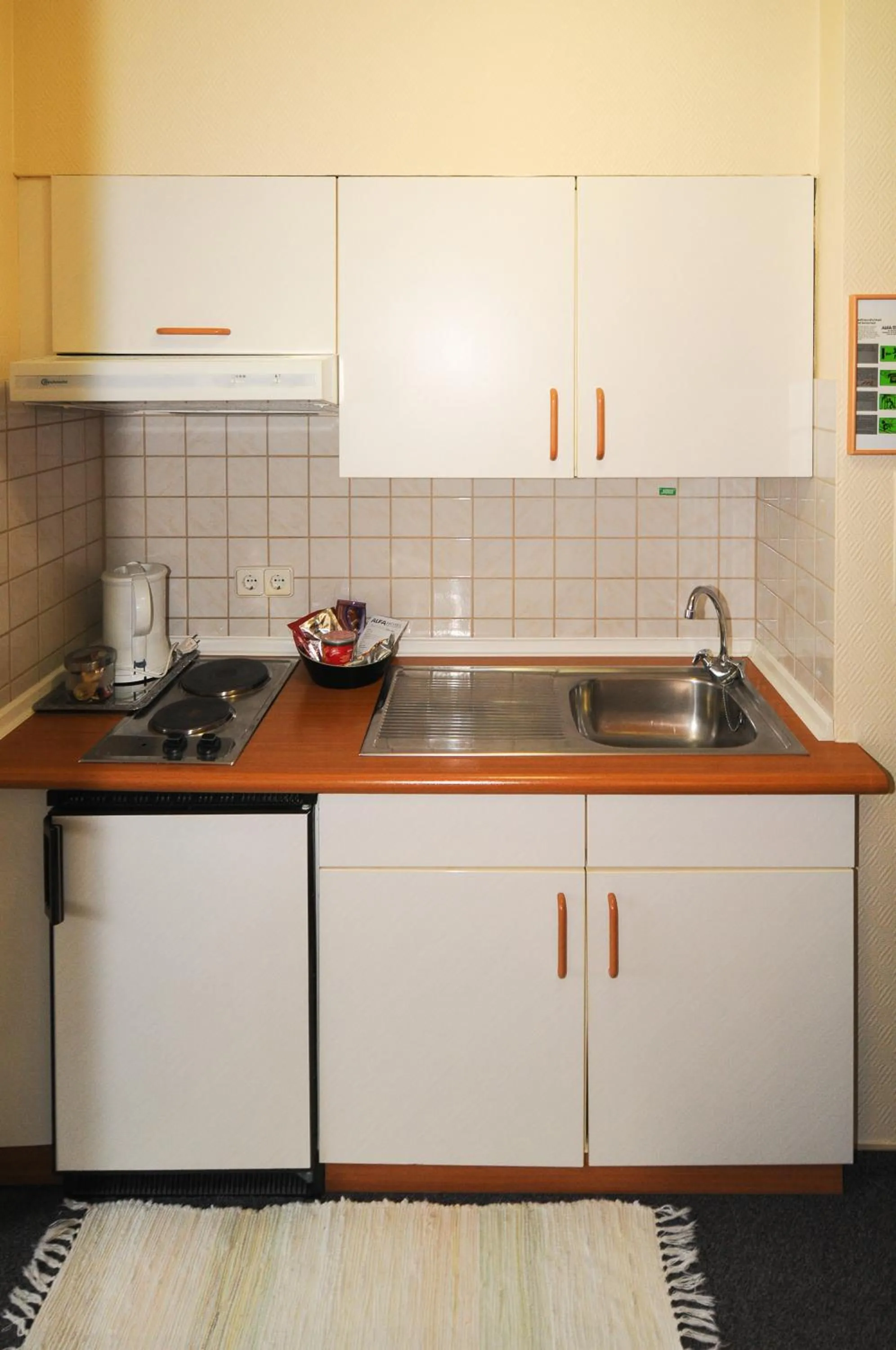 Kitchen or kitchenette in Alfa Apartment Hotel