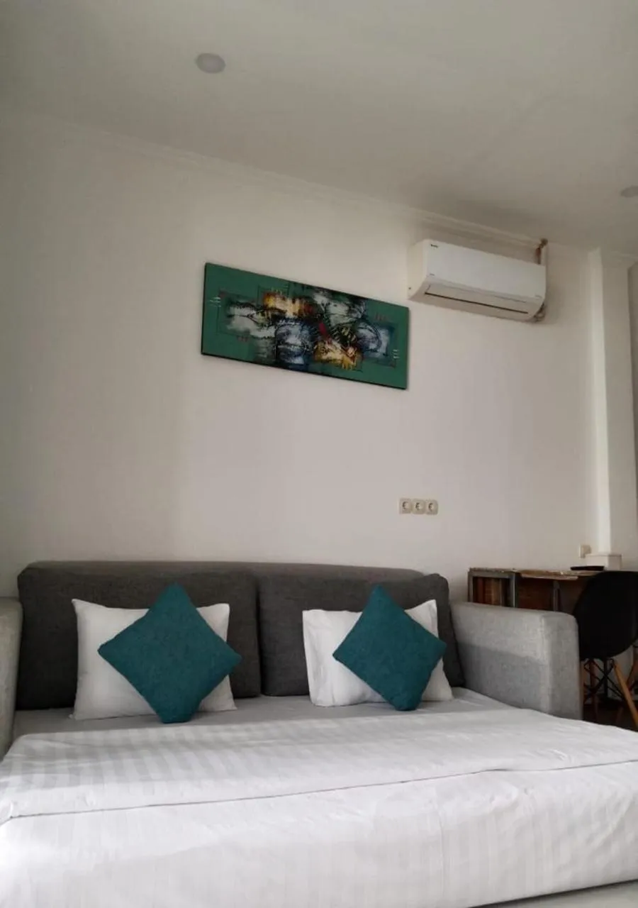 Bed in Triple 8 Suites