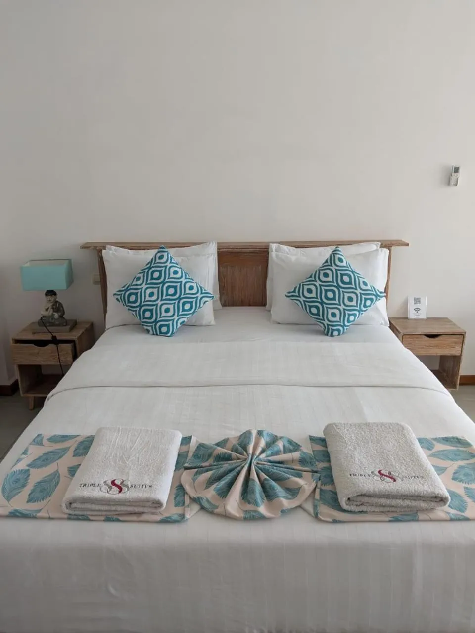 Bed in Triple 8 Suites