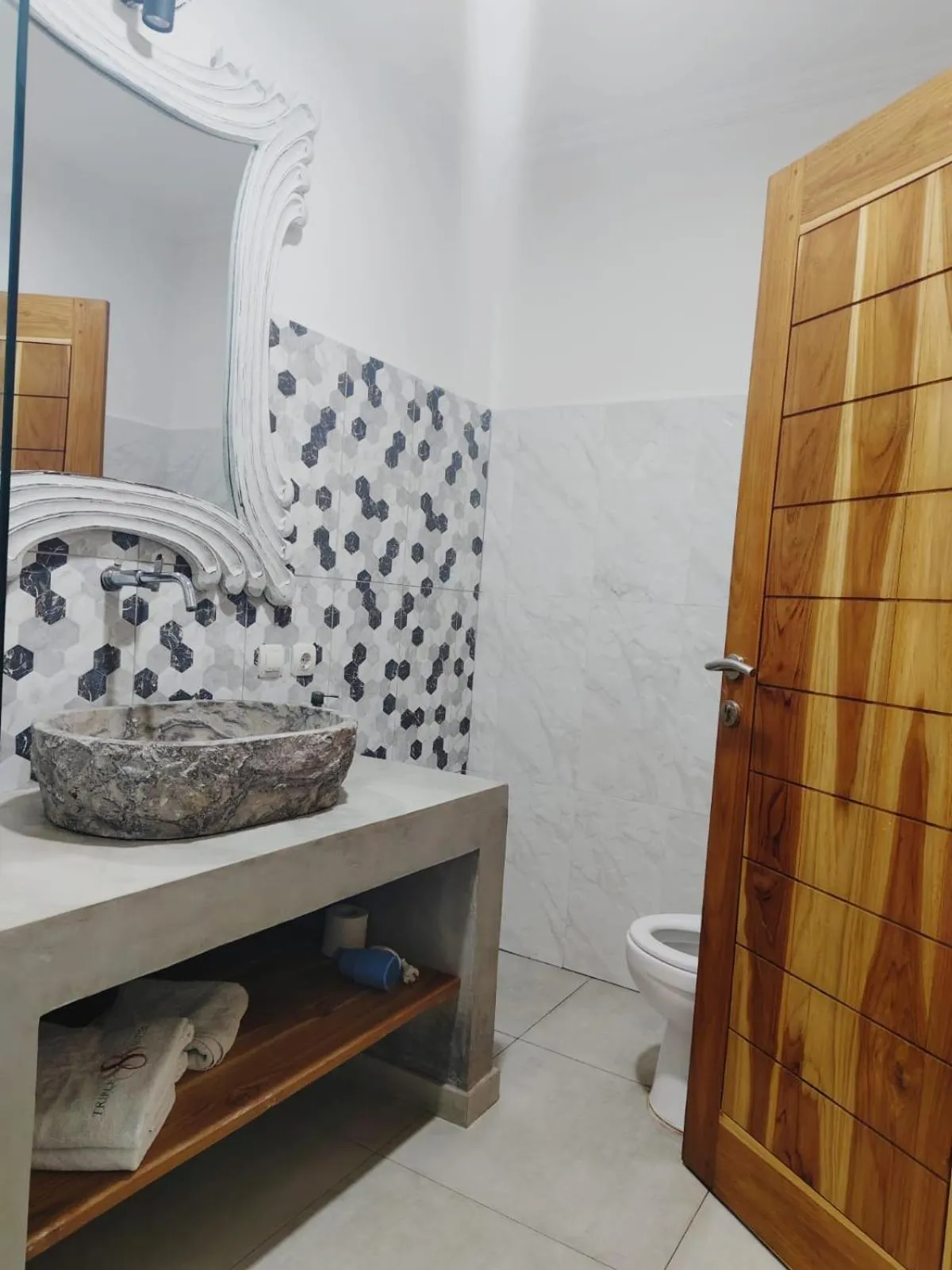 Toilet in Triple 8 Suites