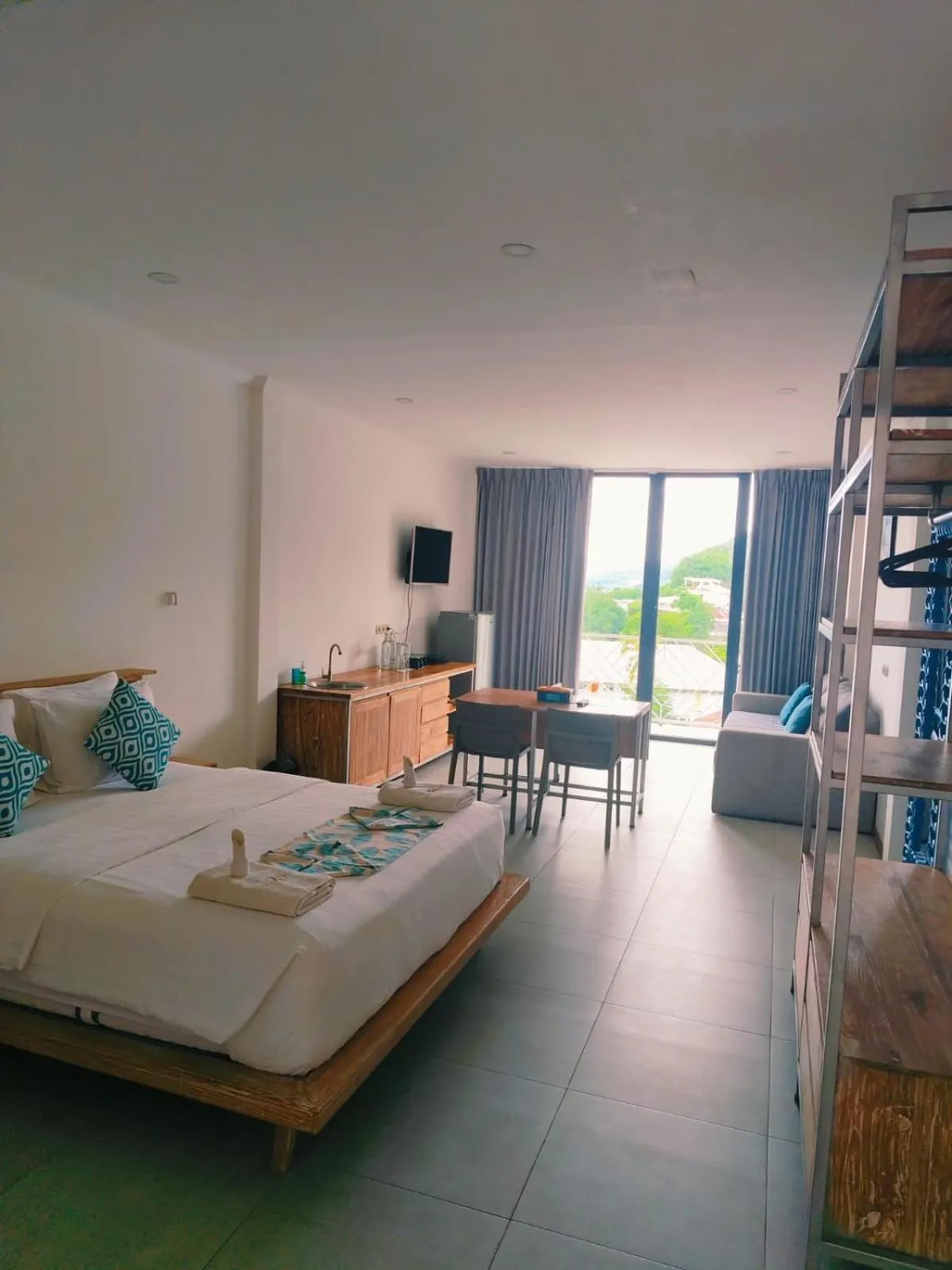 Kitchen or kitchenette, Bed in Triple 8 Suites