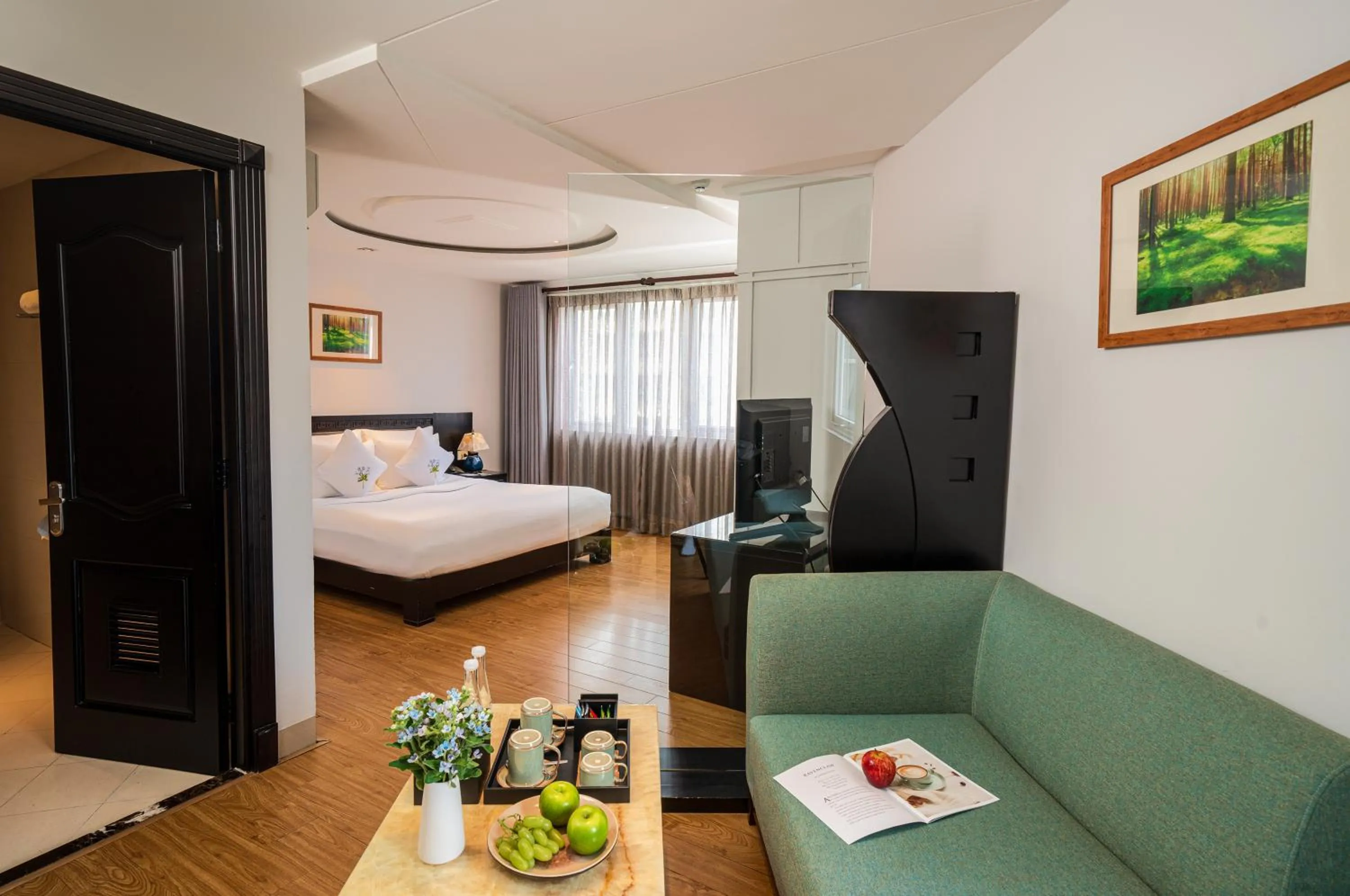 Seating area, Bed in Alagon Saigon Hotel & Spa