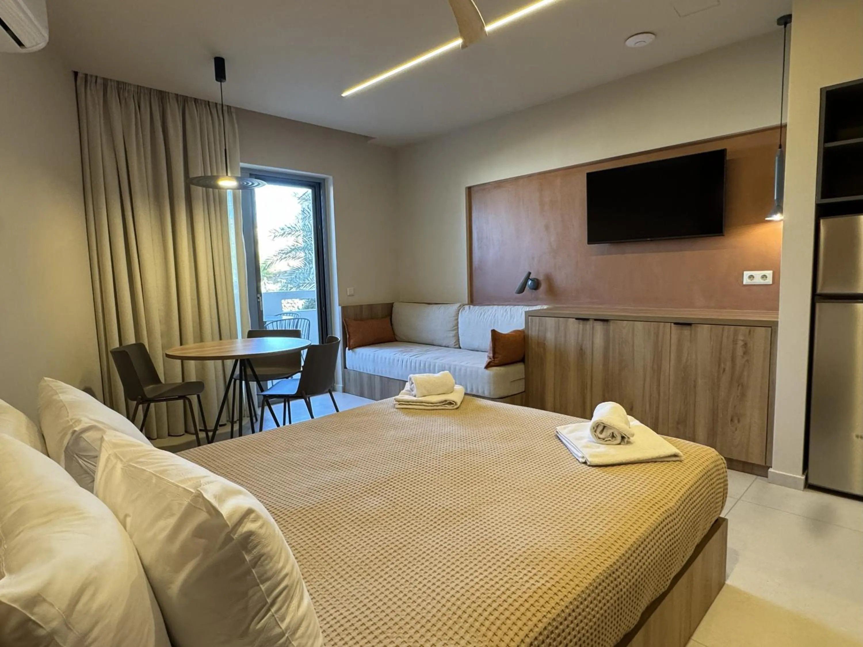 Bed in Philoxenia Apartments