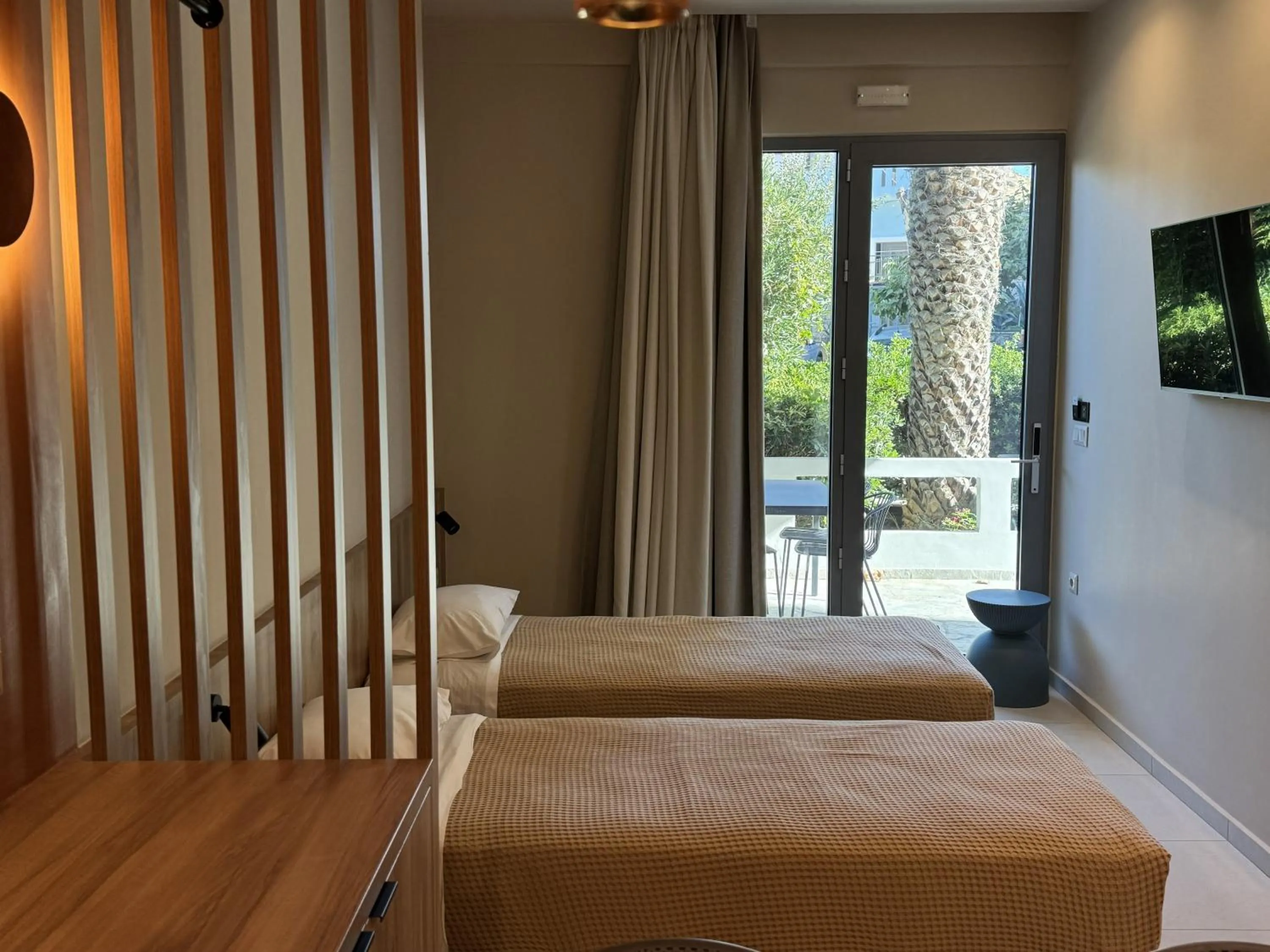 Bed in Philoxenia Apartments