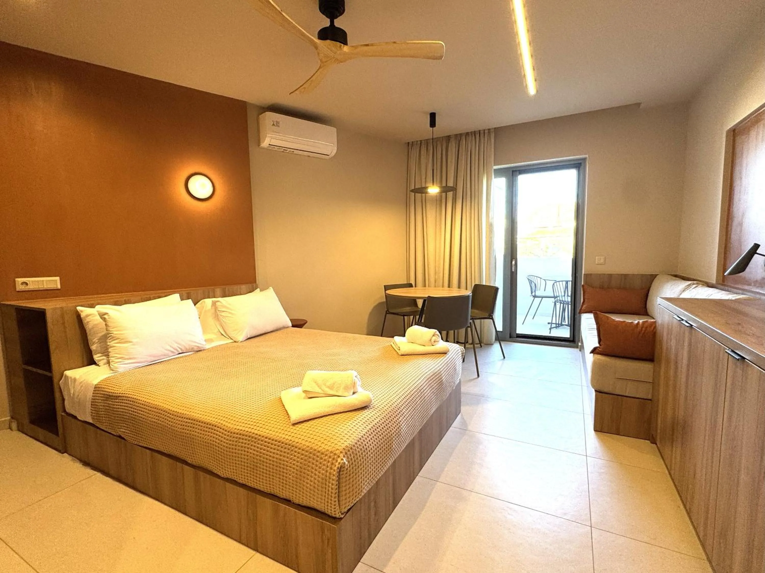 Bed in Philoxenia Apartments