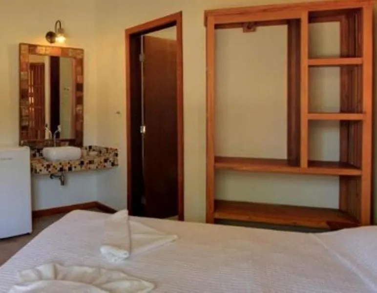 Bed in Pousada Tupinamba