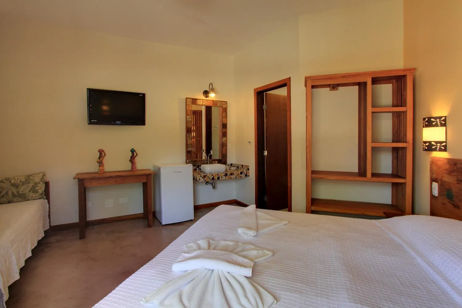 Bed in Pousada Tupinamba