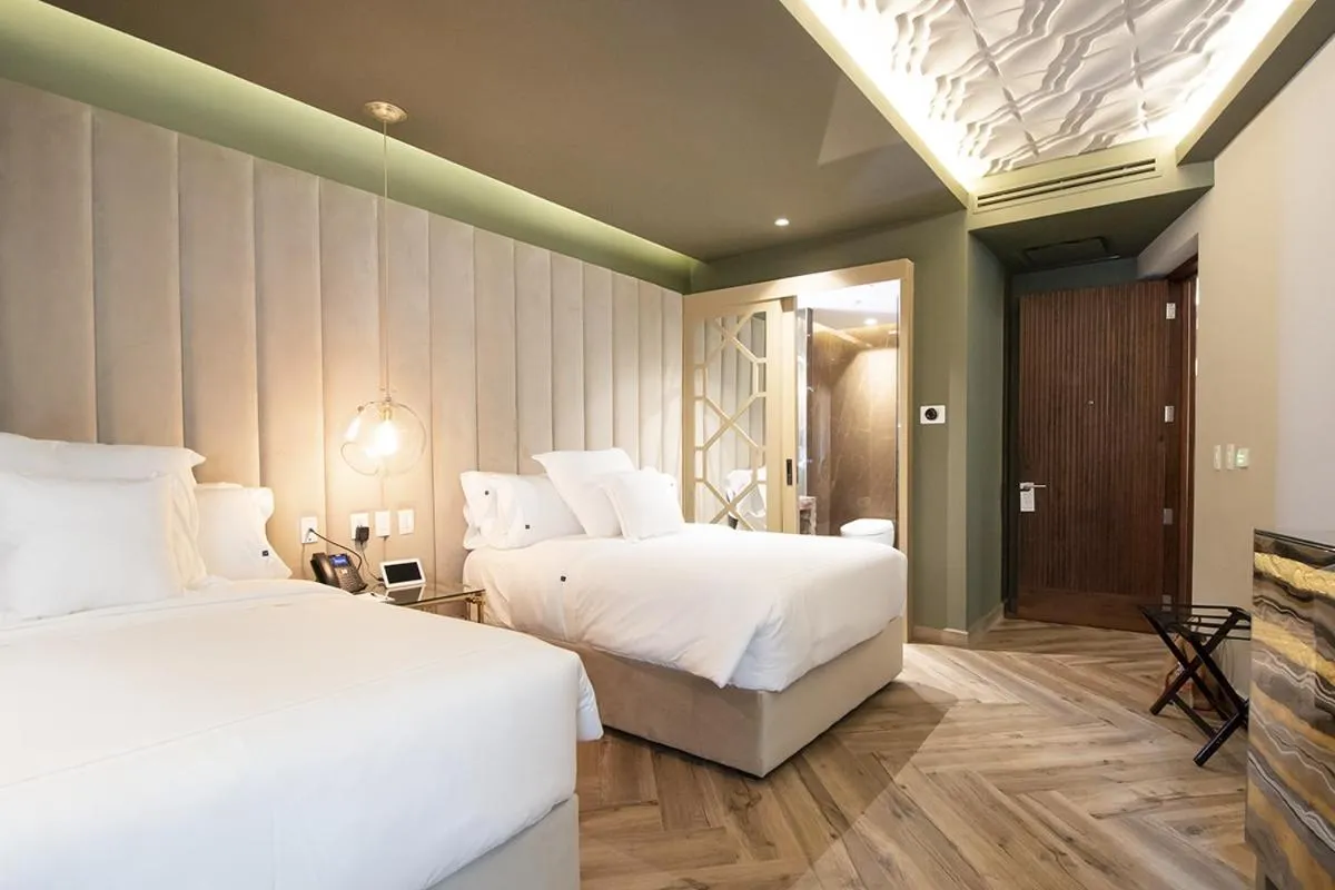 Bed in L Hotel Perla Boutique