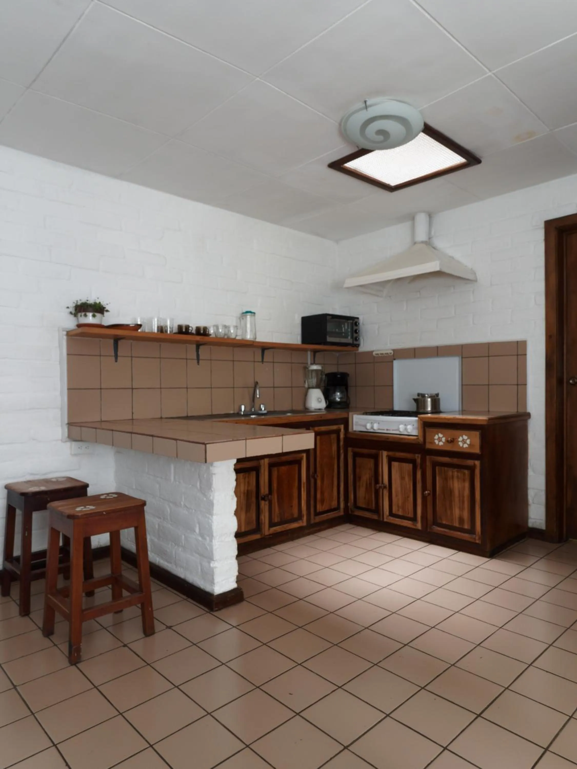 Kitchen or kitchenette in Apartamentos Otorongo Cuenca Ecuador