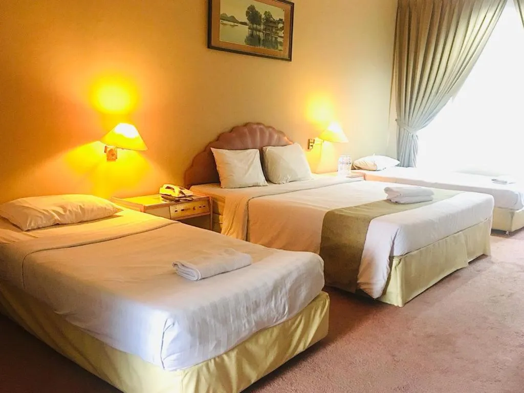 Bed in New Grand Park Hotel