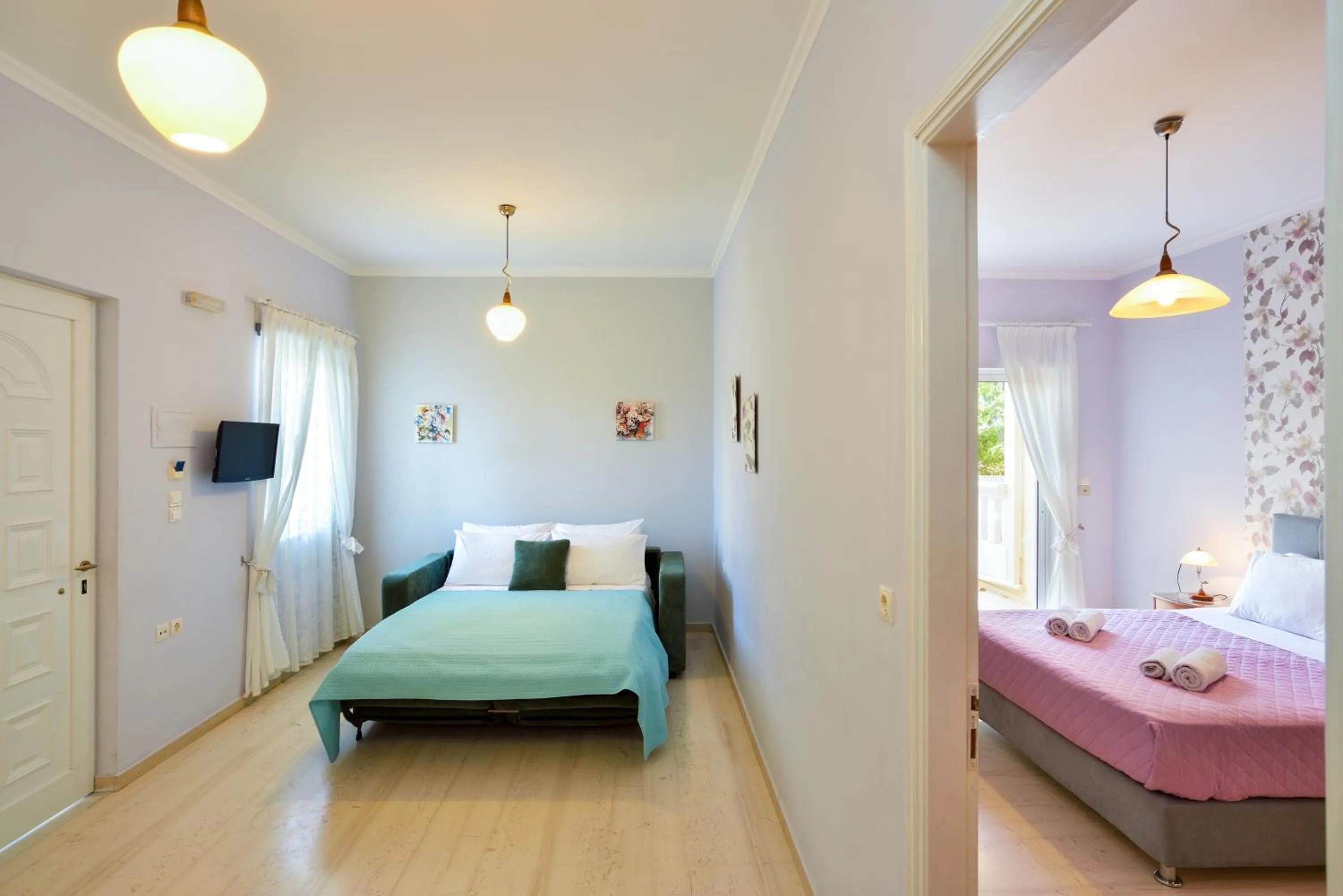 Seating area, Bed in Poseidon Apartments