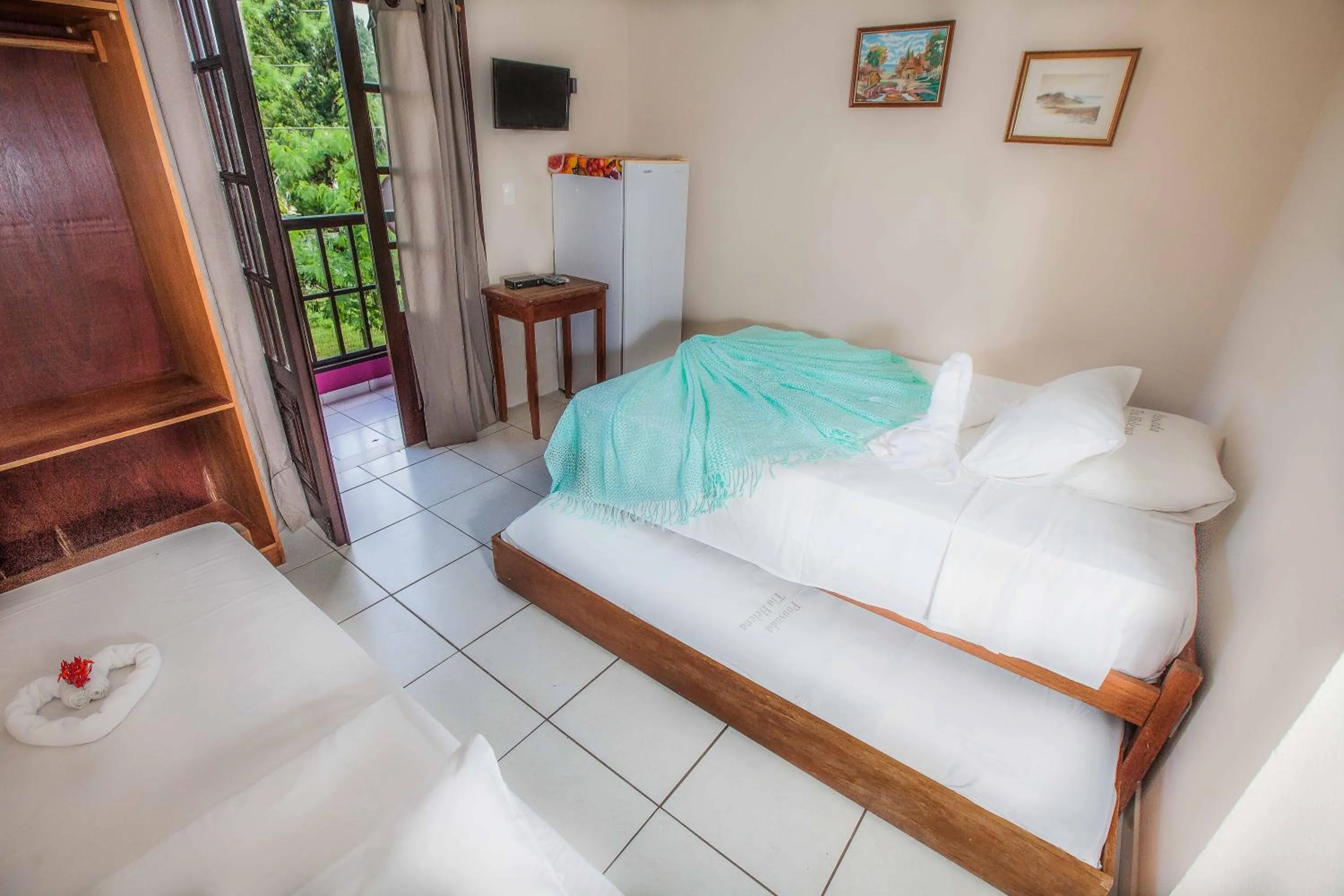 Bed in Pousada Tia Helena