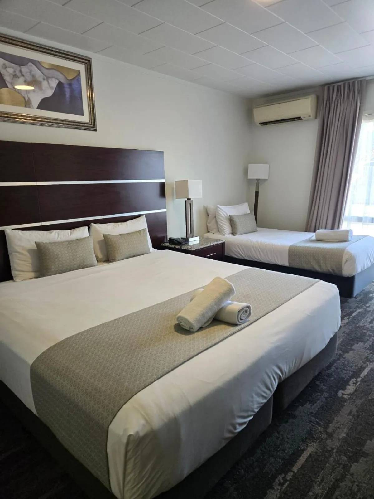 Bed in Airport Gateway Hotel